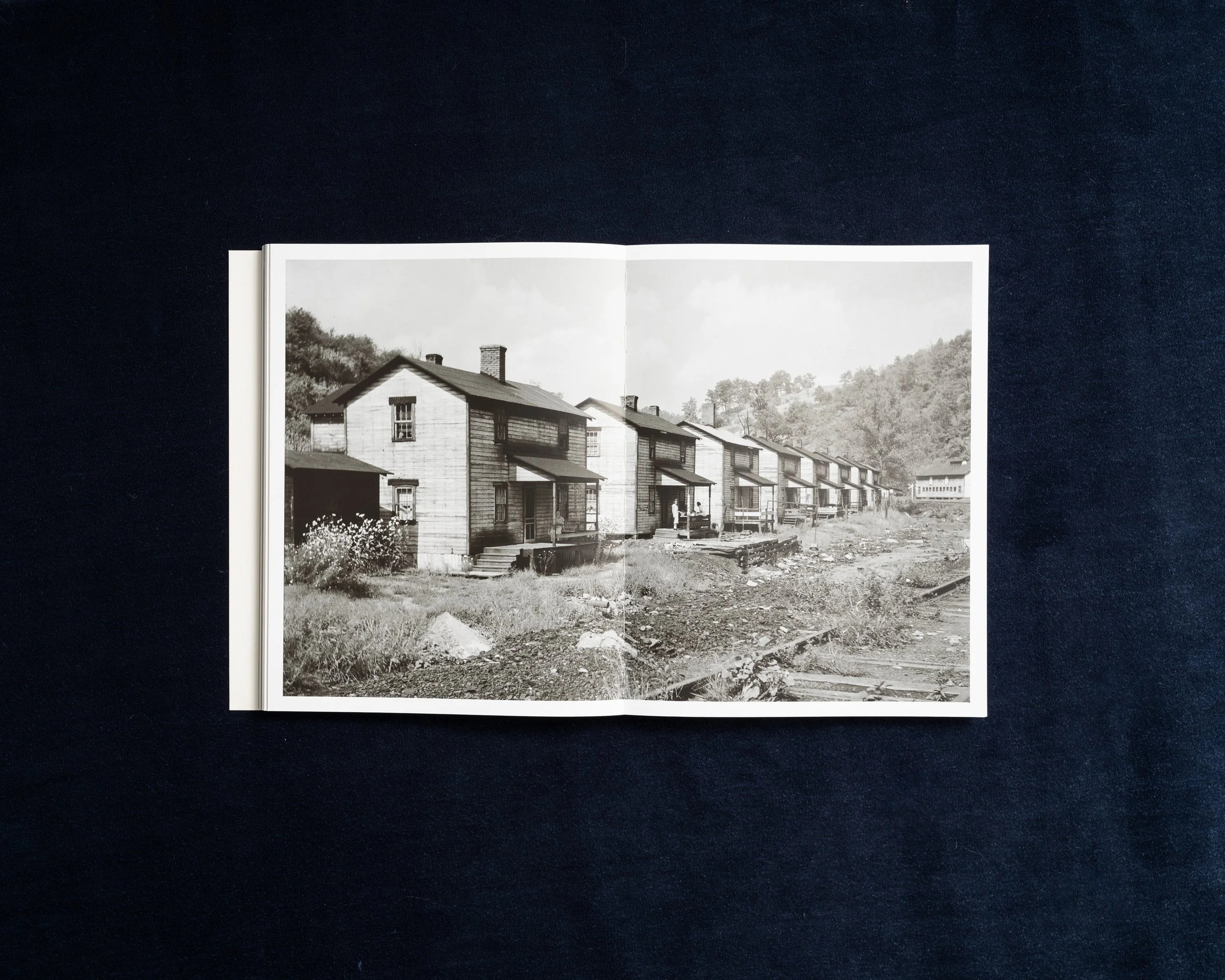 Archival photograph of rows of Appalachian company houses in Stacy Kranitz’s photobook
