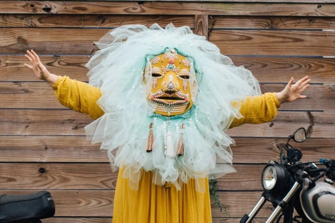 Basqo Bim figure wearing pastel sculptural mask with white tulle; link to TikTok