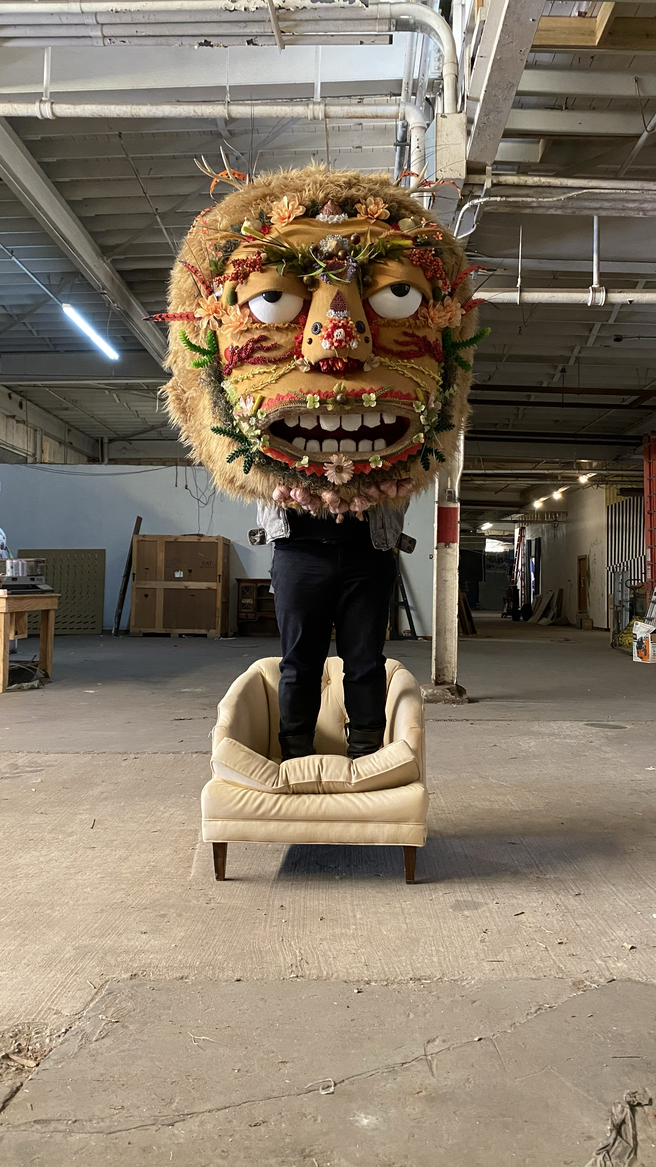 A giant furry monster head puppet named King Pecueca.