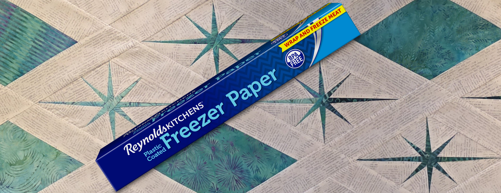 Freezer Paper on a foundation paper pieced star quilt top