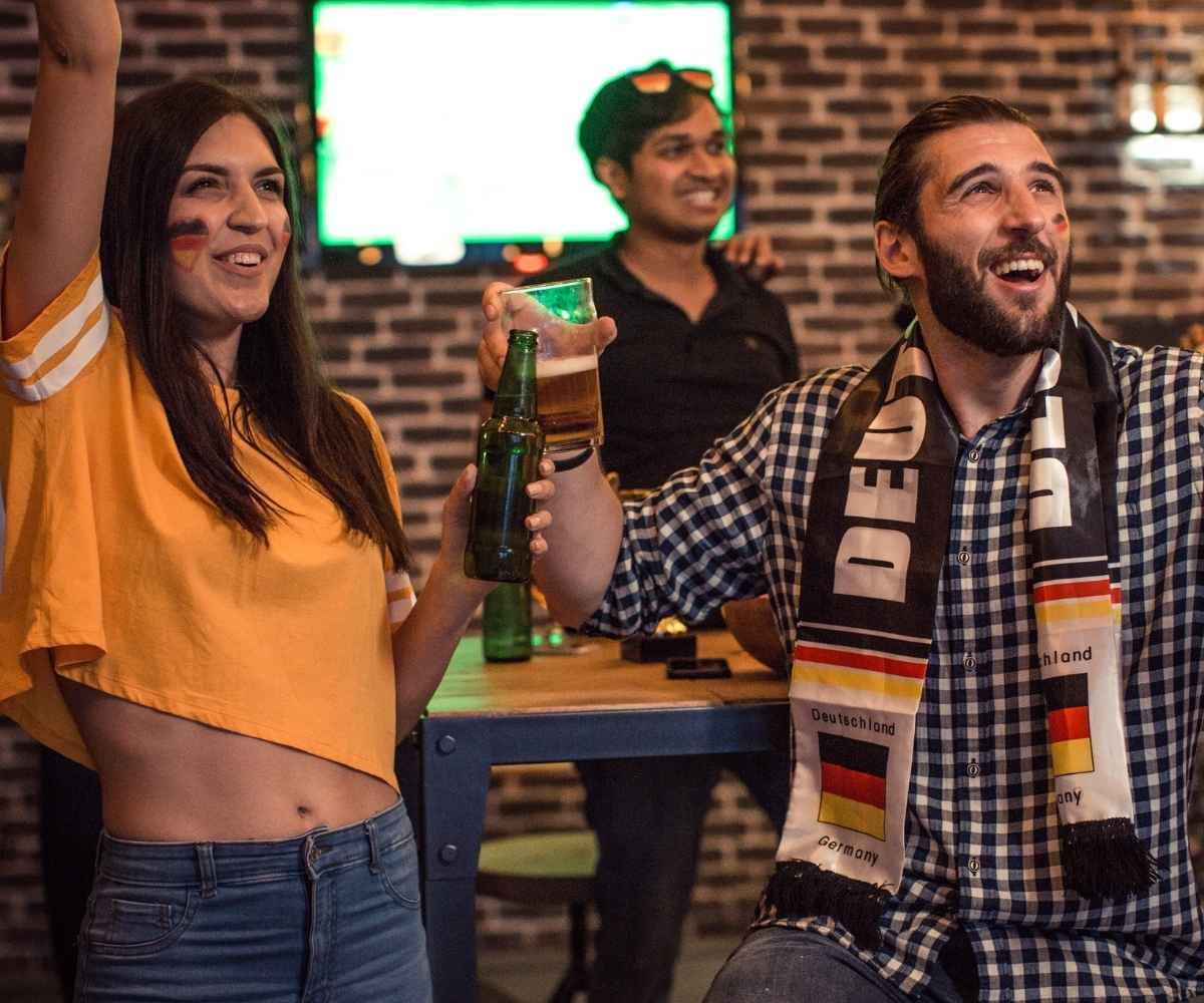 Official World Cup trophy on the pitch layout designating the exclusive group stage schedule for 12 selected Midtown Manhattan bars.