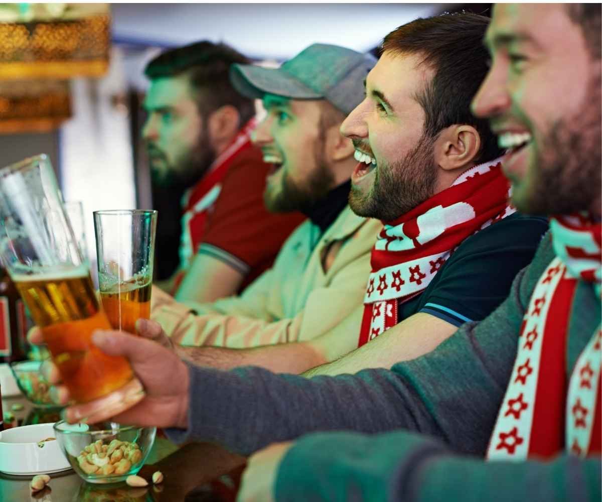 Crowd of supporters gathered at the top times square football pub.