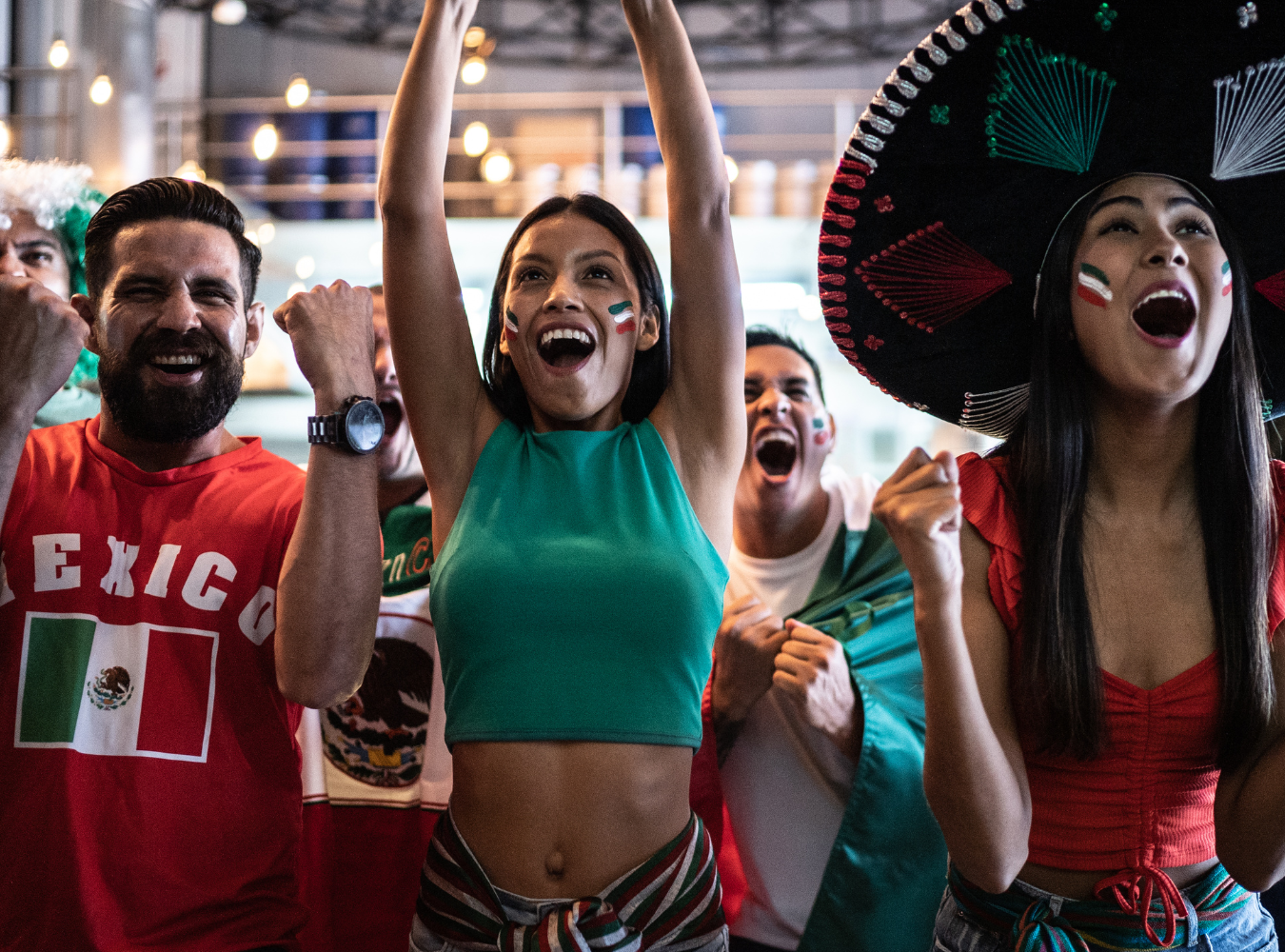 A massive crowd of Mexico national team supporters in "El Tri" jerseys gathering for an official 2026 World Cup watch party near Rockefeller Center, creating an elite international fan zone atmosphere.
