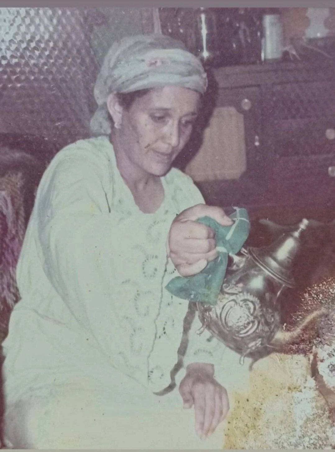 Sanaa Darif mother pouring moroccan mint in a tea ceremony.