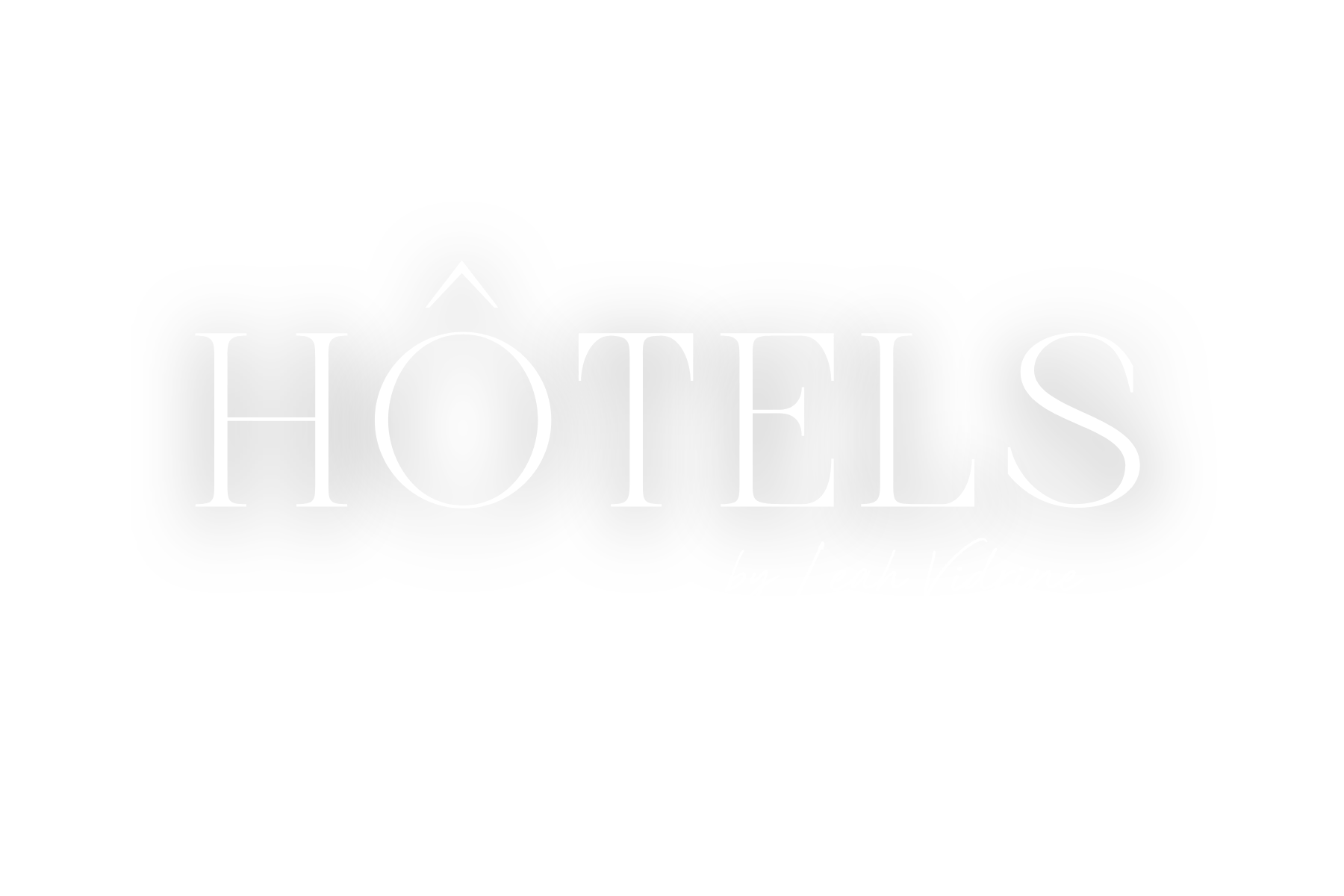 Black background with white text reading "HÔTELS" in large letters and "by Leah Vidrine" in smaller cursive letters beneath.