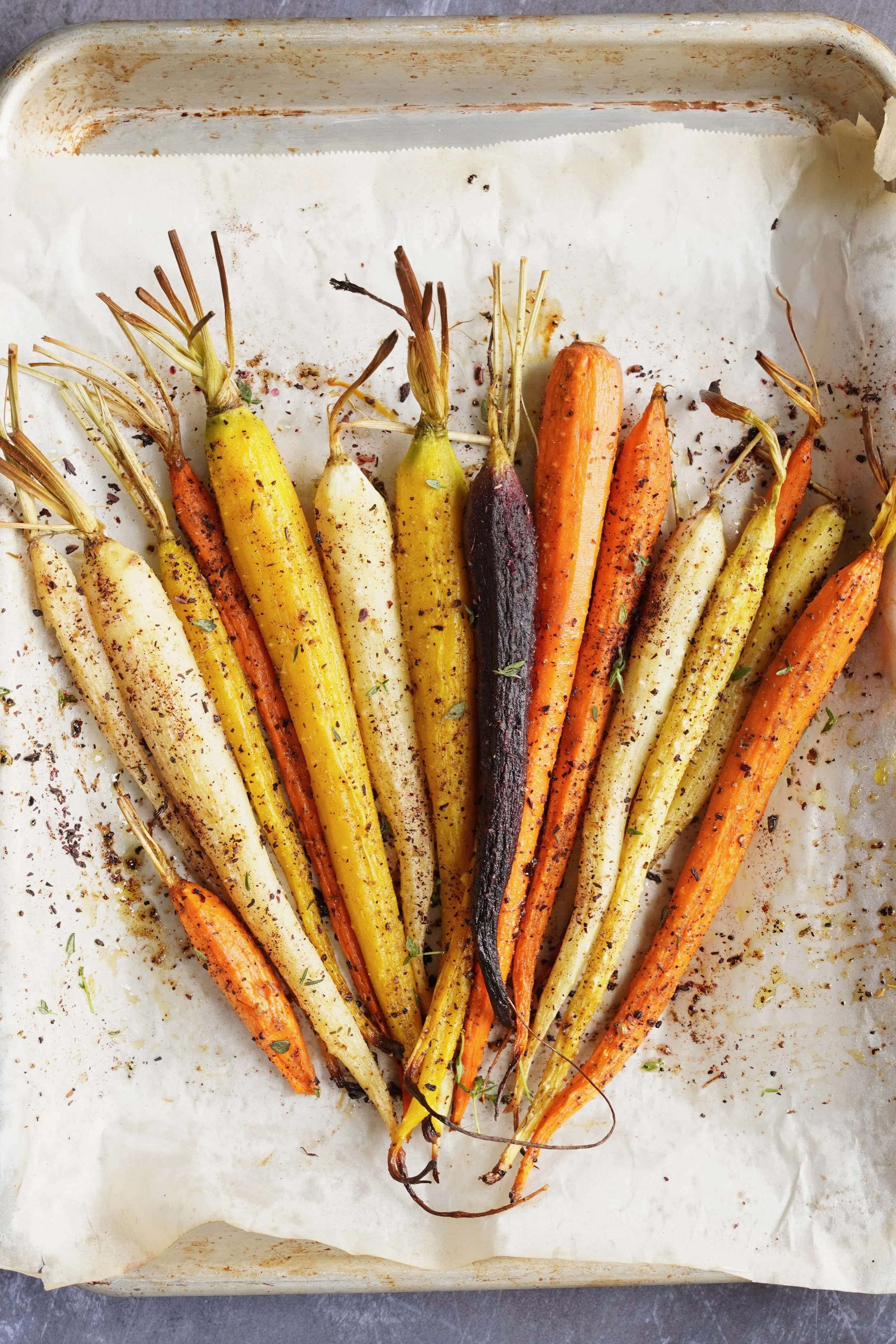 A variety of roasted carrots topped with spices and sorrel rub