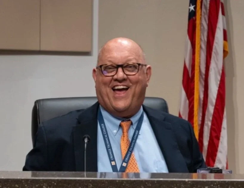 Mike Armbruster at the Orange County School Board dais (Florida).