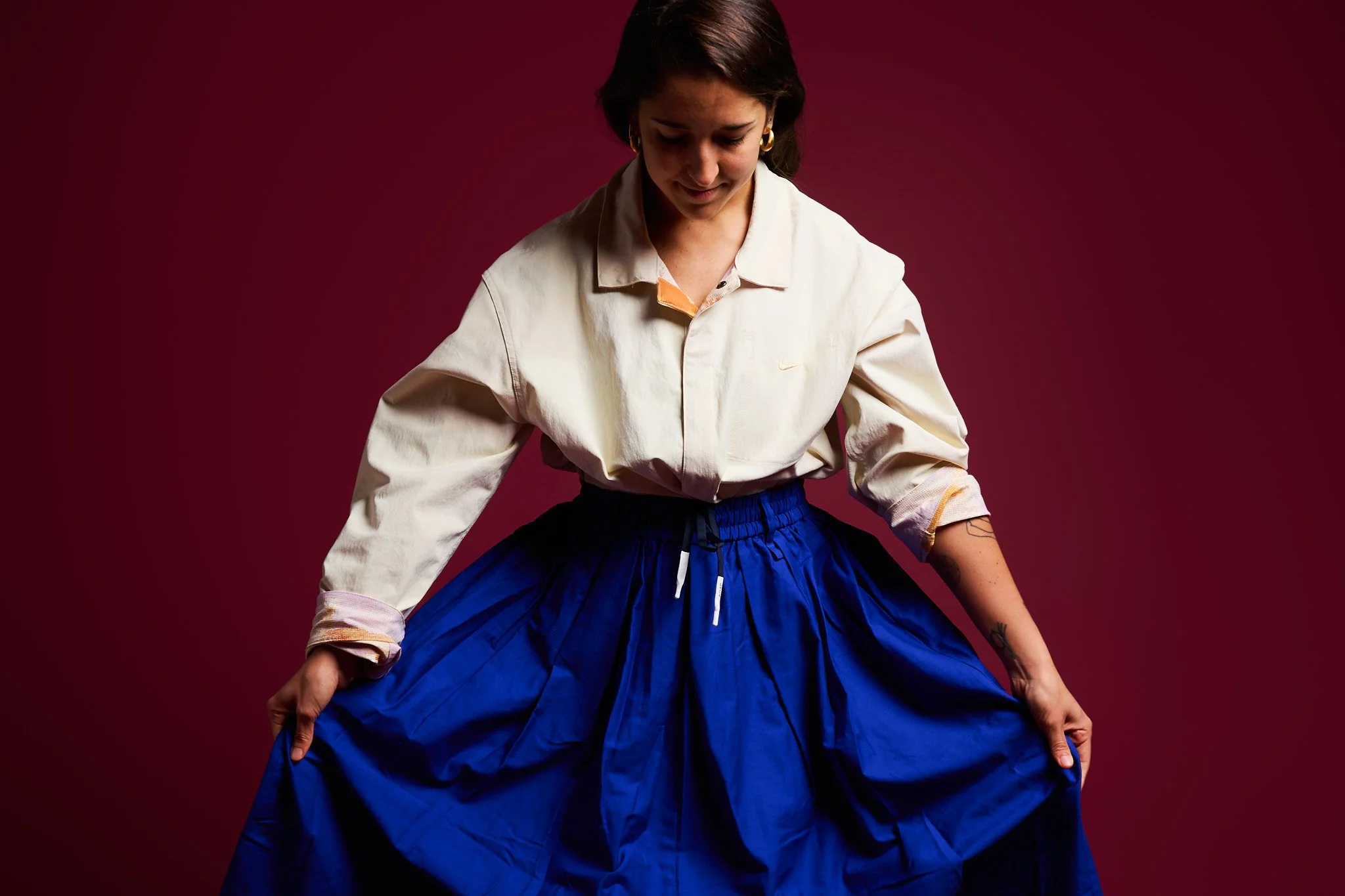 Person standing in stillness, embodying calm presence and awareness.