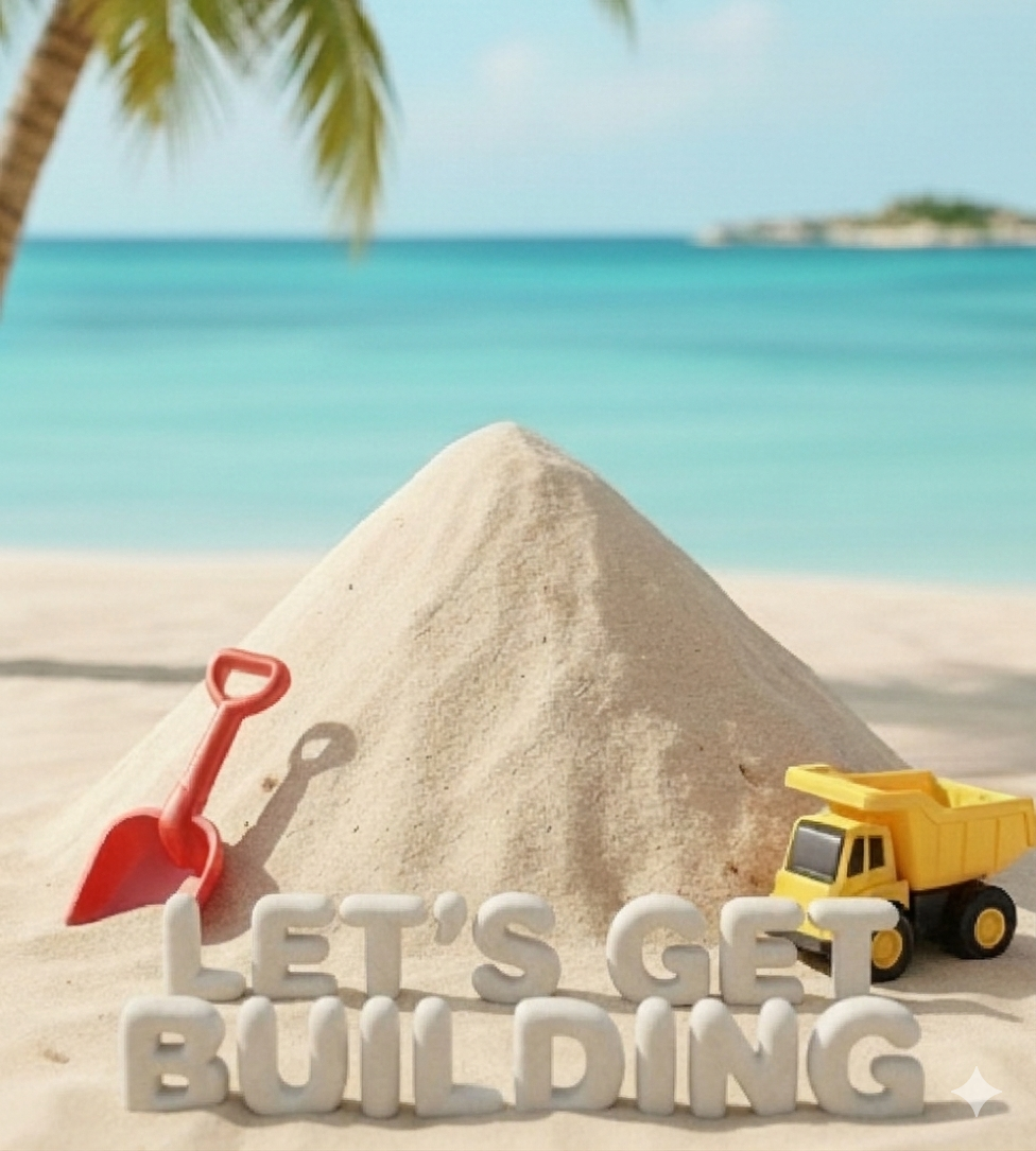 Toy construction set on a sandy beach with a pile of sand, a yellow toy dump truck, a small red shovel, and white letters spelling 'Let's Get Building' in front of the sand dune. There are palm trees and the ocean in the background.