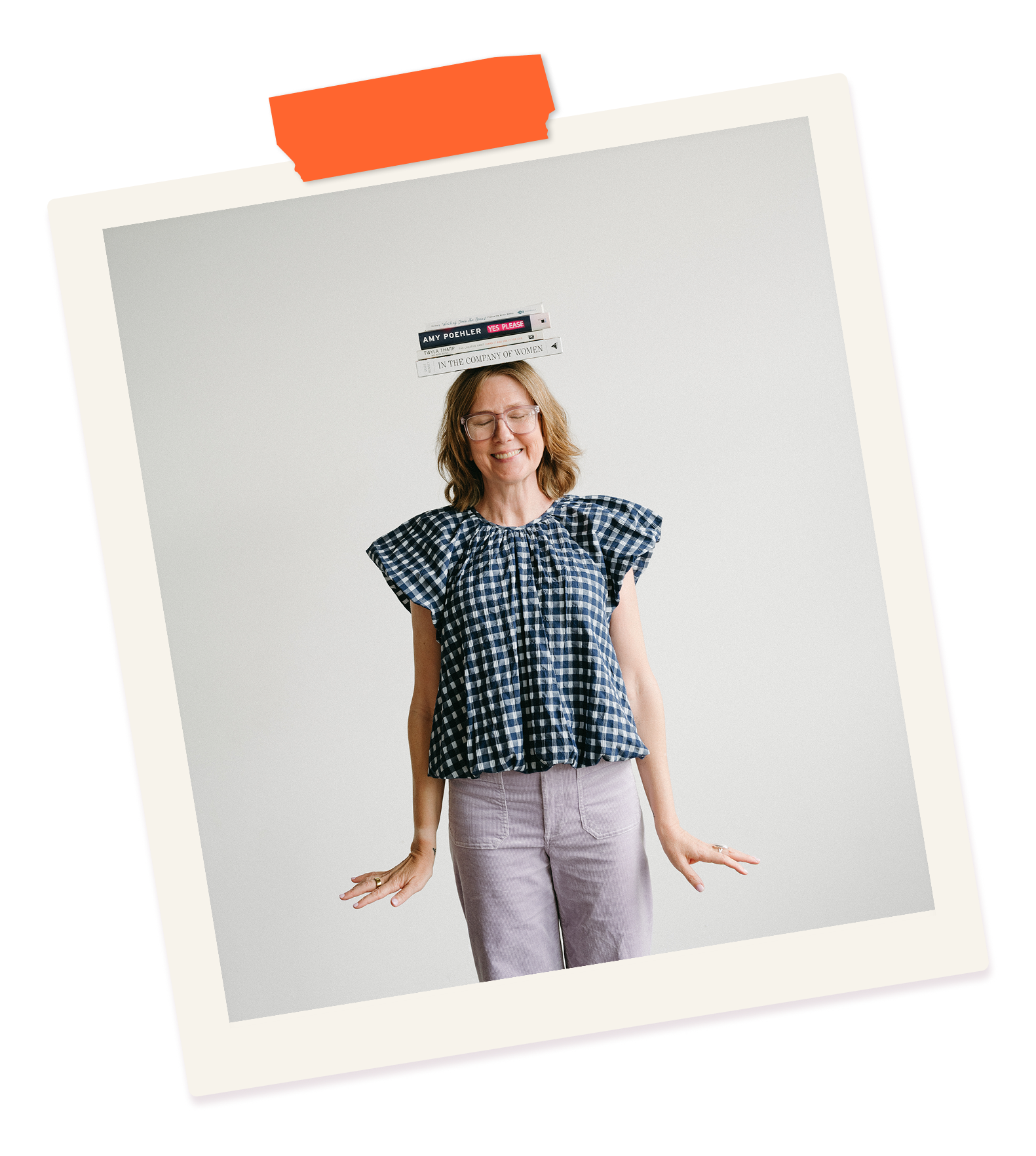 coach tammie bennett stands with books balanced on her head.