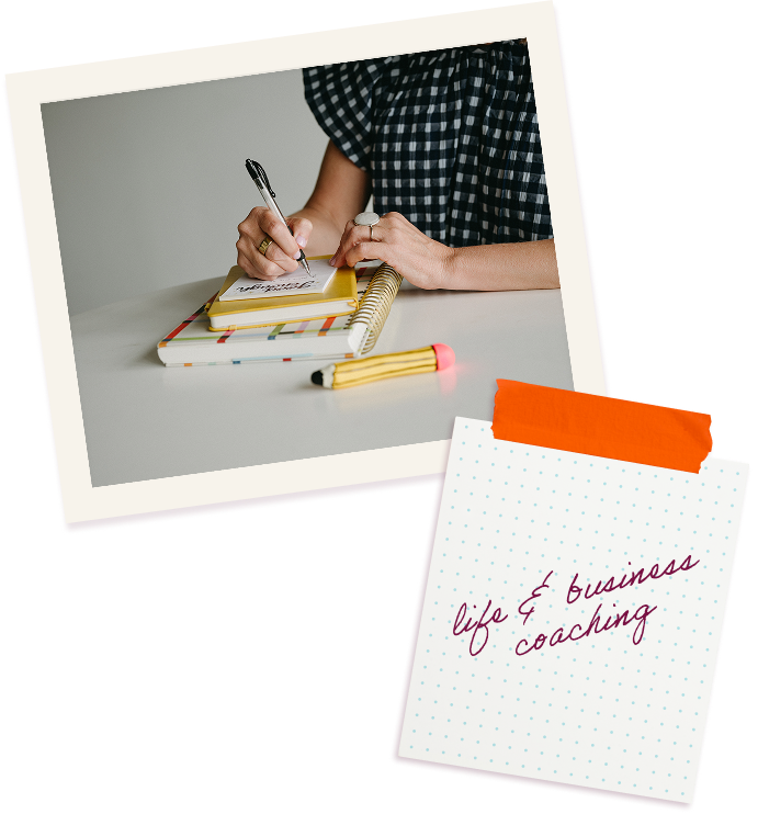 image of person writing a note on a stack of notebooks and a memo that says life and business coaching
