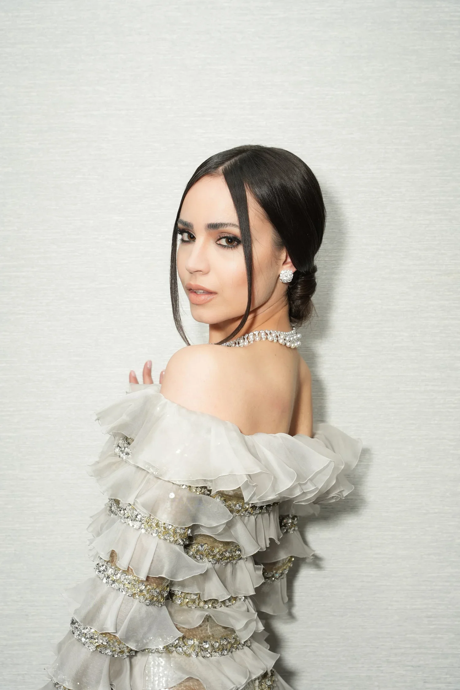 A clean, modern beauty portrait highlighting glowing skin, refined makeup, and natural elegance.