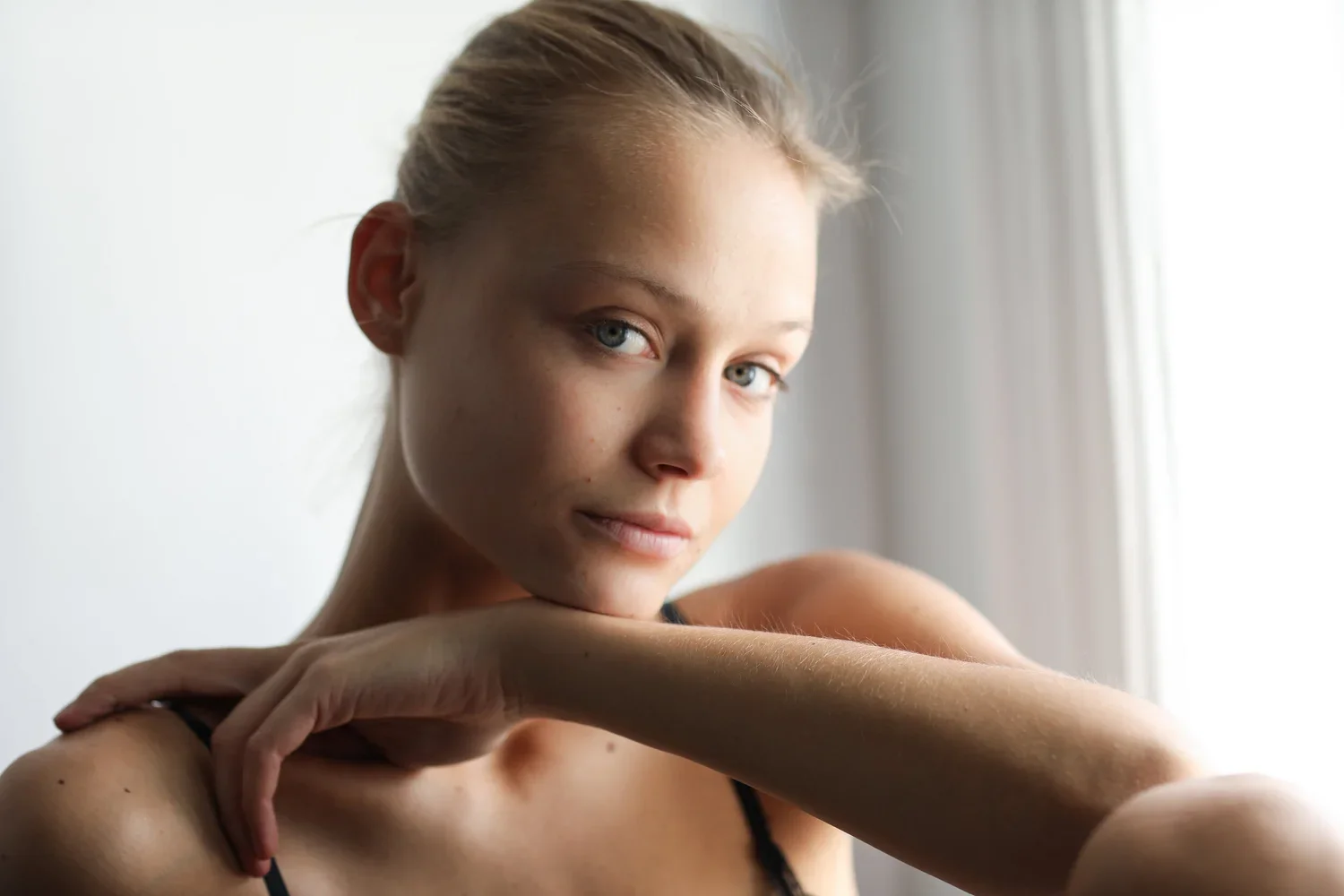 A clean, modern beauty portrait highlighting glowing skin, refined makeup, and natural elegance.