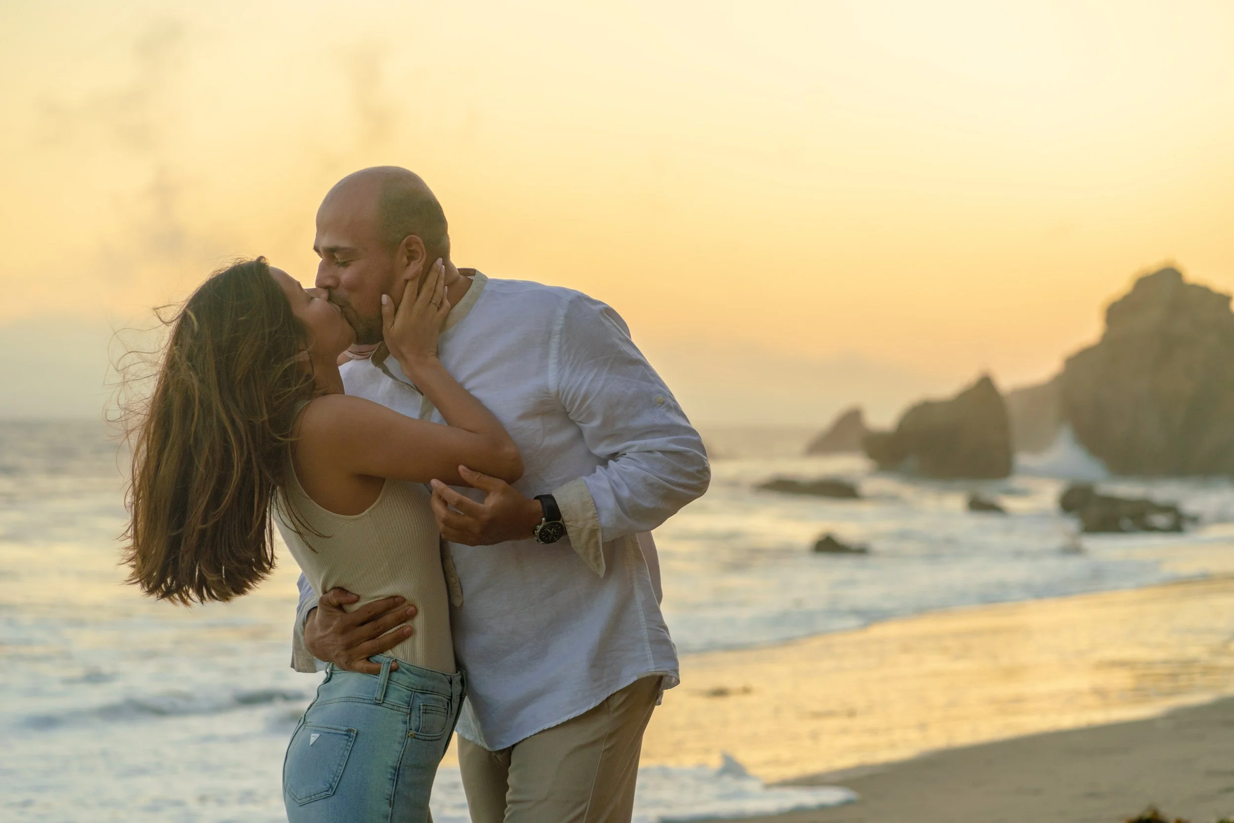 A warm, romantic portrait captured in the final light of day, where soft tones and natural movement create an effortless, timeless feel.