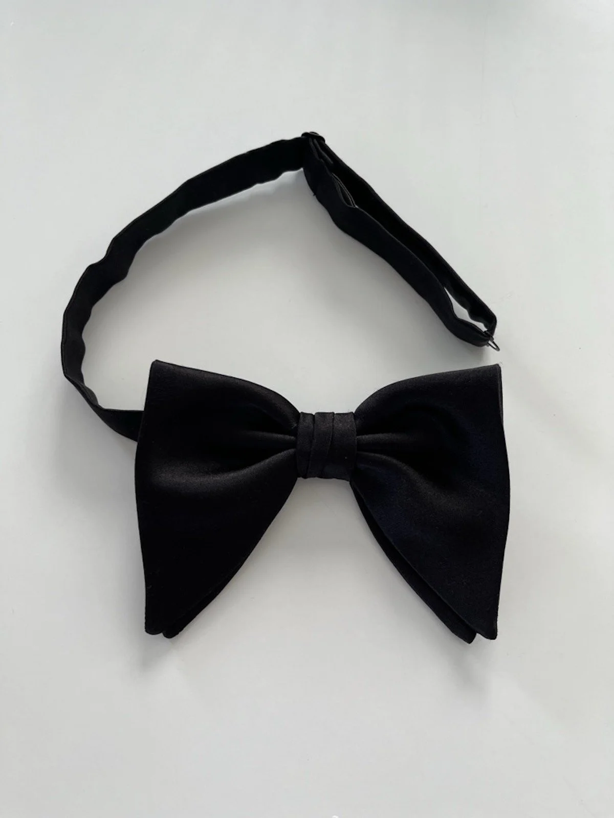 This is a classic large, Butterfly, bow tie.  It is self-tied.  Hand-made and elegant.