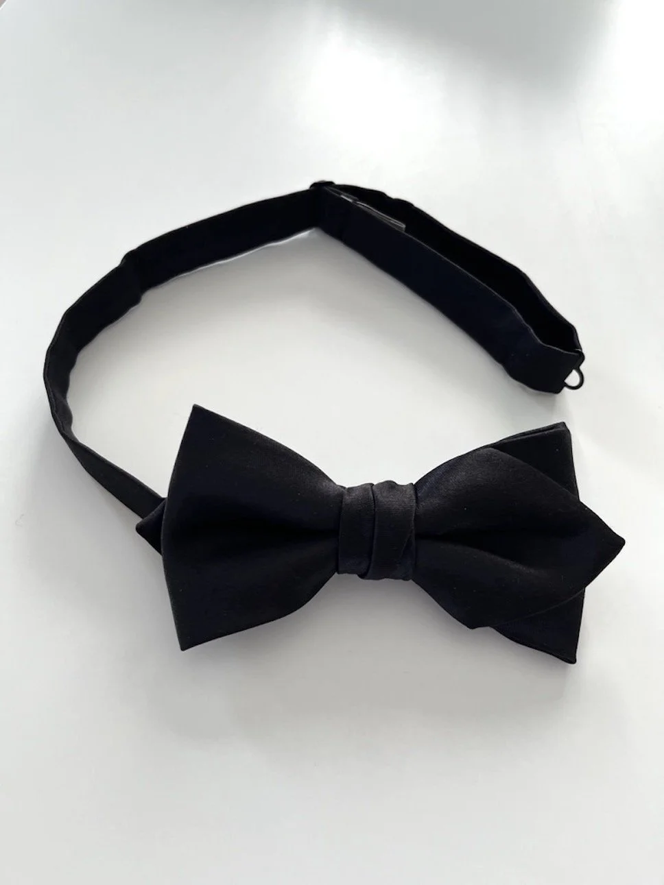 Classic, diamond shape, pre-tied, black silk bow tie.