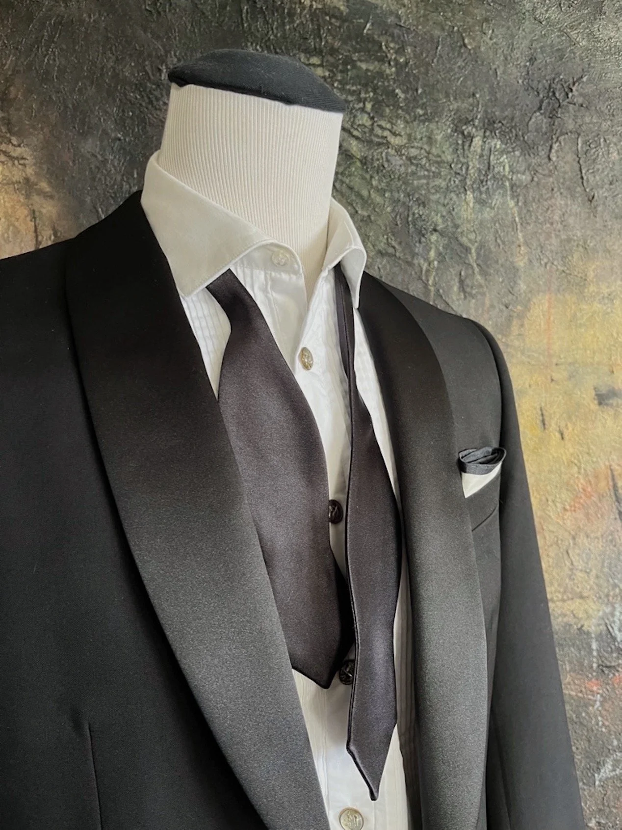 This is a silk, diamond shape, self-tied bow tie.  It is hand-made and of superior quality