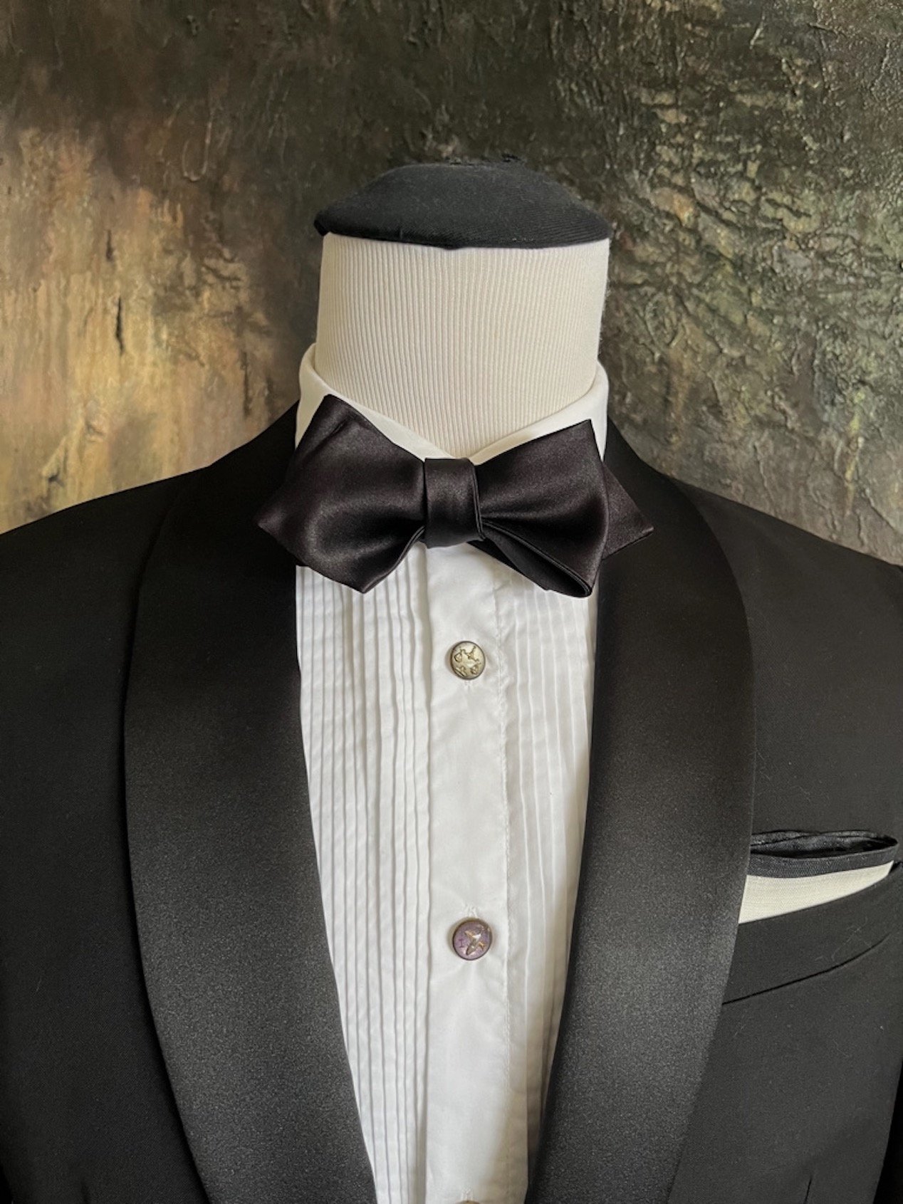 This is a silk, diamond shape, self-tied bow tie.  It is hand-made and of superior quality