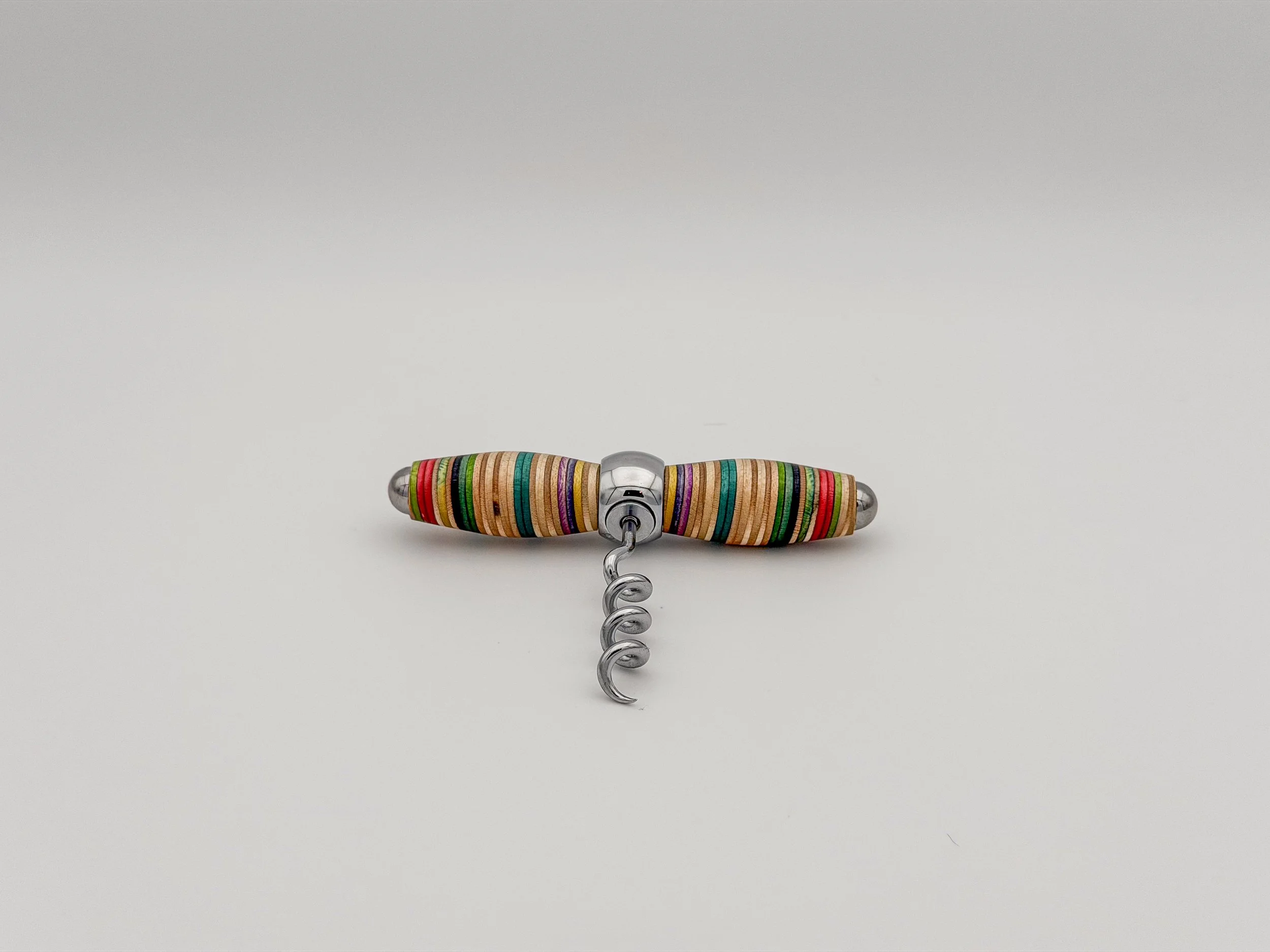 A corkscrew with a metal handle and a spiral metal screw, laying on a plain white background.