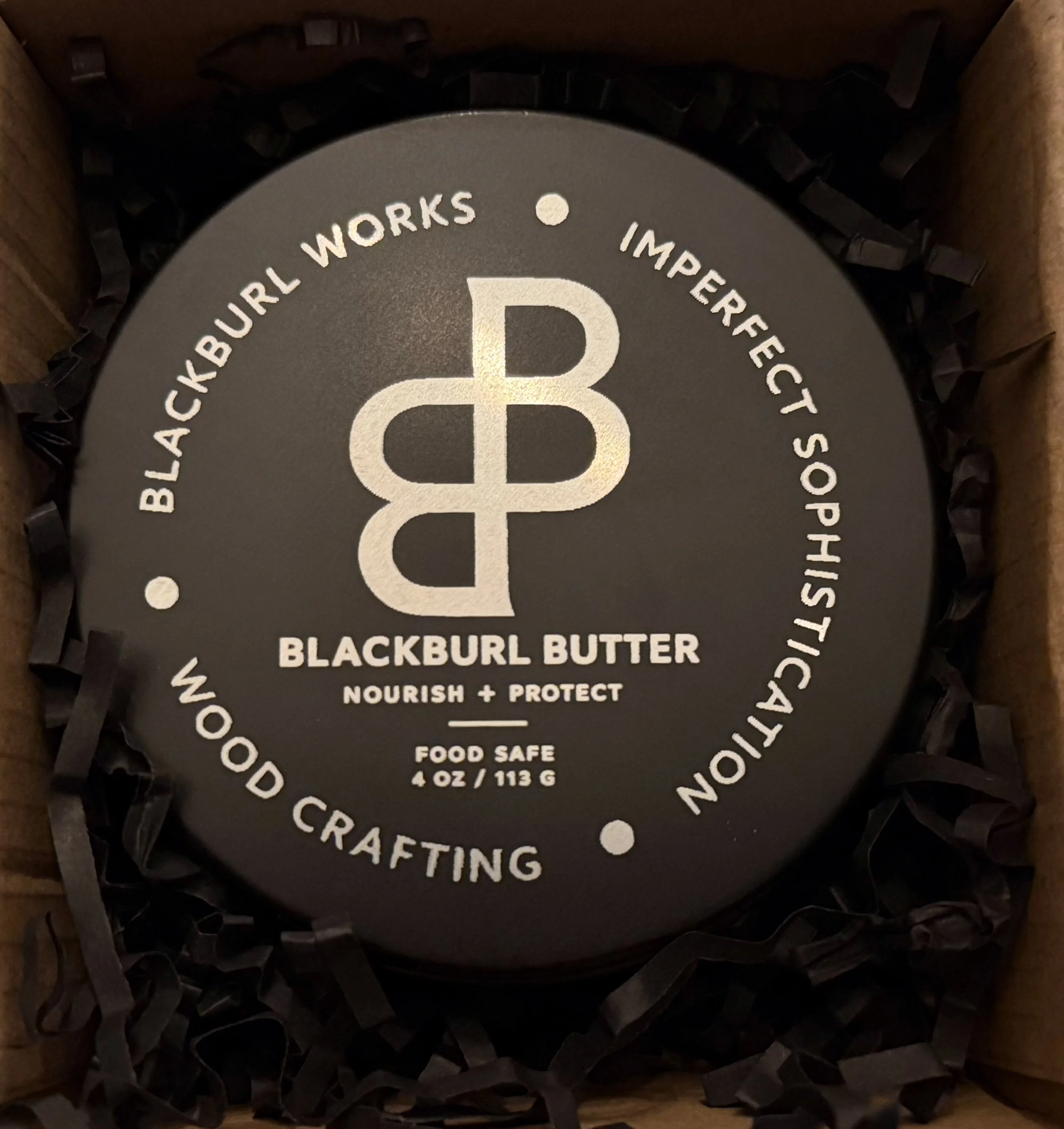 Blackburl Butter wood conditioner in premium gift box with black crinkle paper packaging.