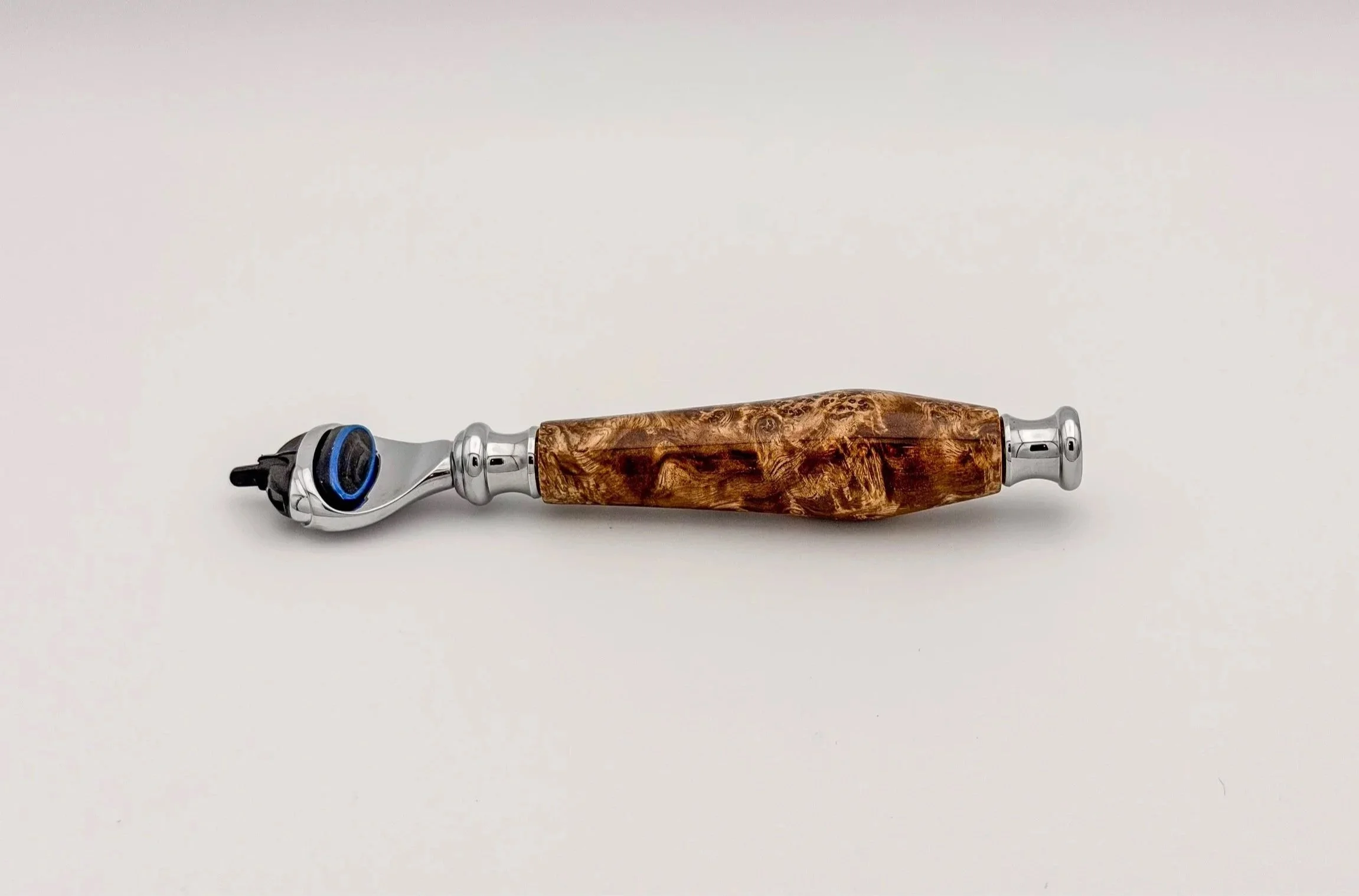 Handcrafted Mach3 razor with a figured burl wood handle, made by Blackburl Works in Fernie, British Columbia, Canada.