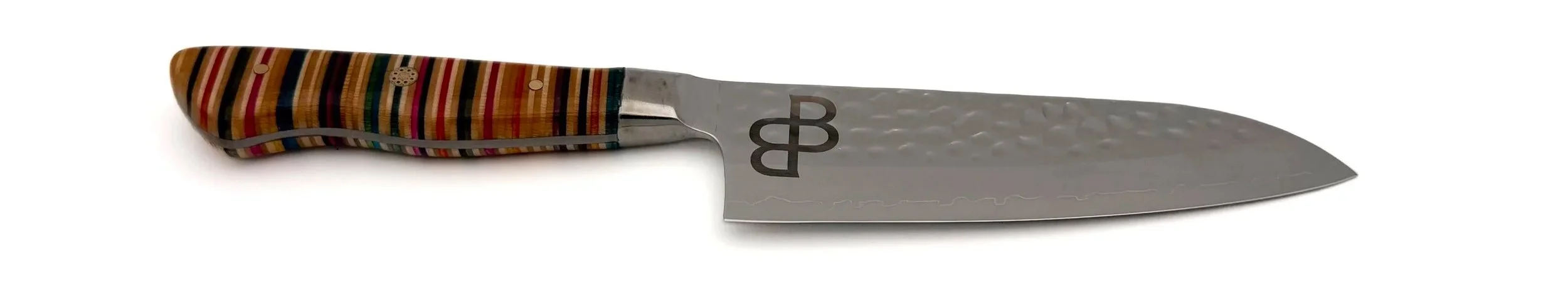 A japanese damascus steel knife with a recycled skateboard wood handle. black burl mark on the black