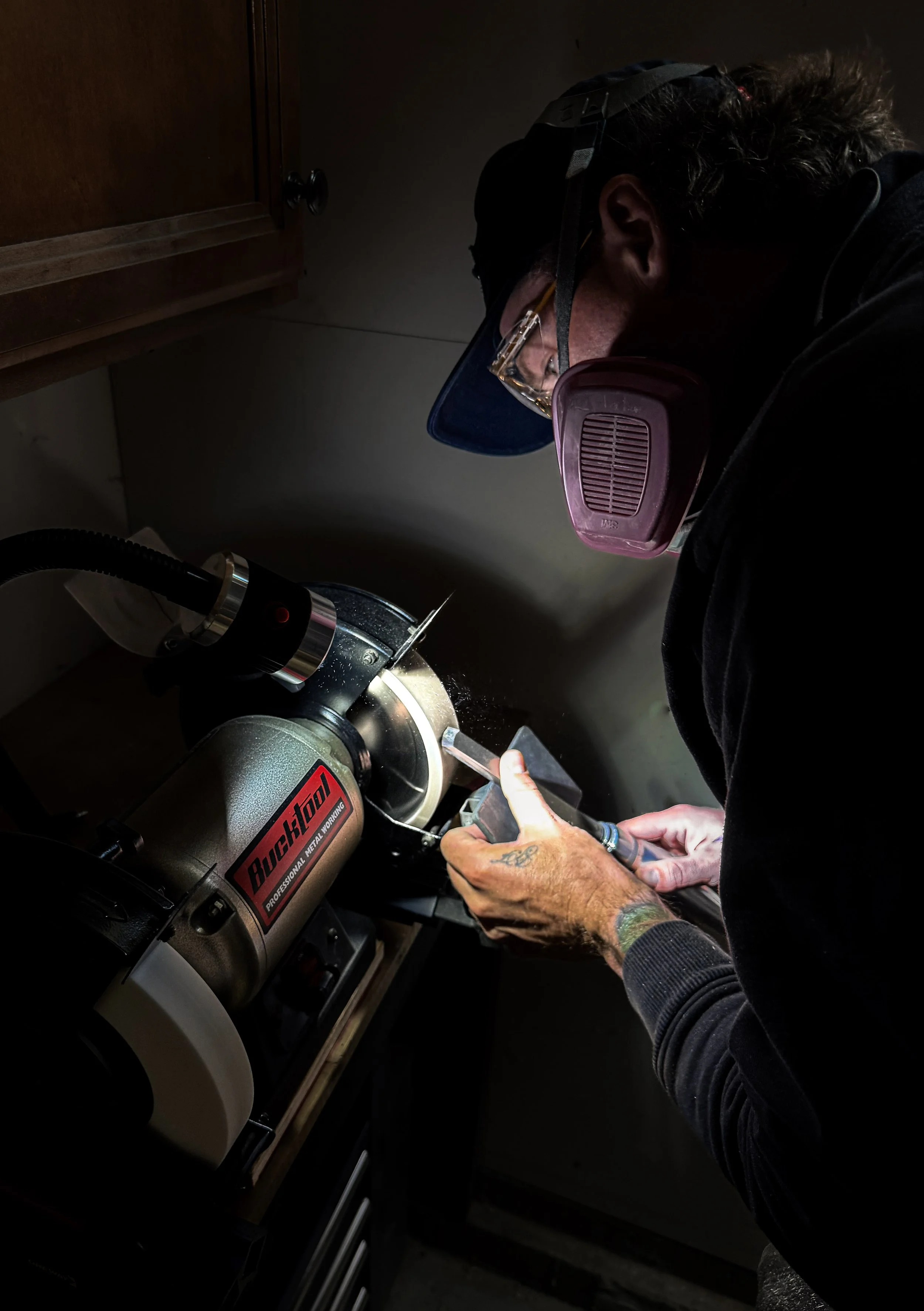 Sharpening a bowl gouge before hand turning hardwood bowls at Blackburl Works in Fernie, British Columbia, Canada.