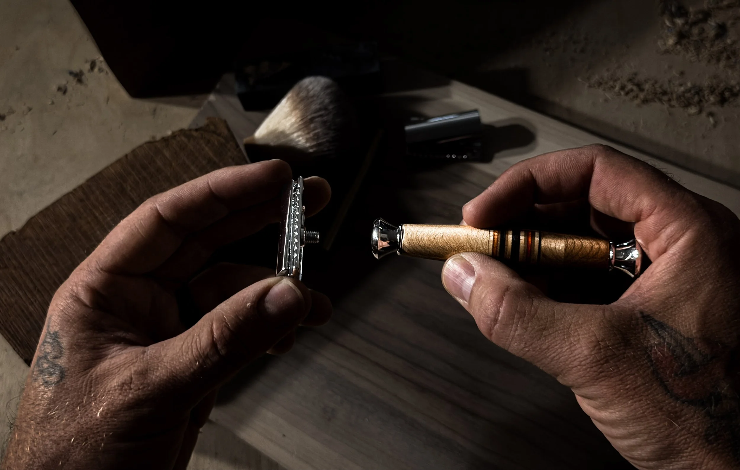 Cleaning a handcrafted safety razor with a premium burl wood handle at Blackburl Works in Fernie, British Columbia, Canada.