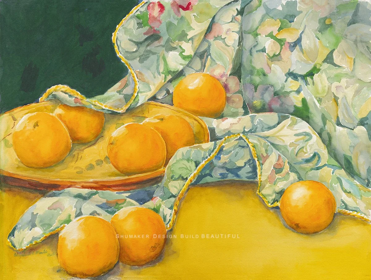 Oranges on floral table cloth-  Elizabeth Martin