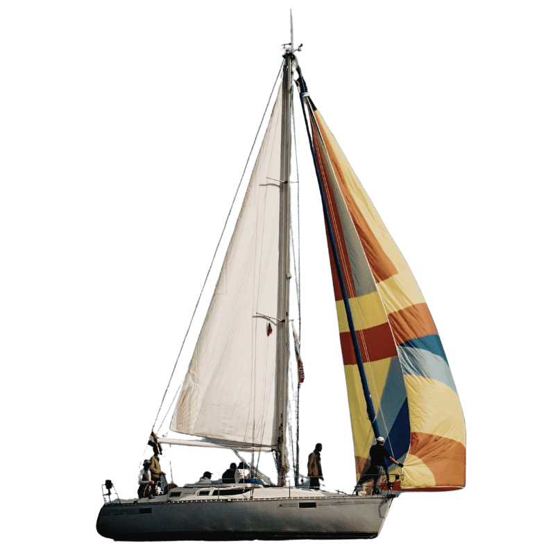 A sailboat with two sails, one white and the other multicolored, sailing alone on water during the day.