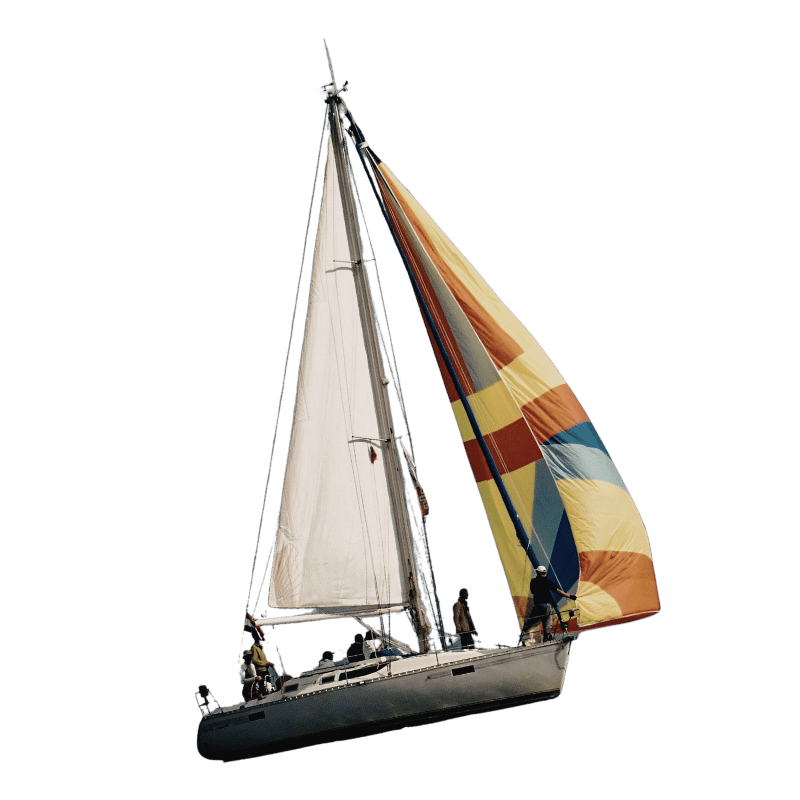 A sailboat with a colorful spinnaker sail and a white mainsail, sailing on open water with four people onboard.