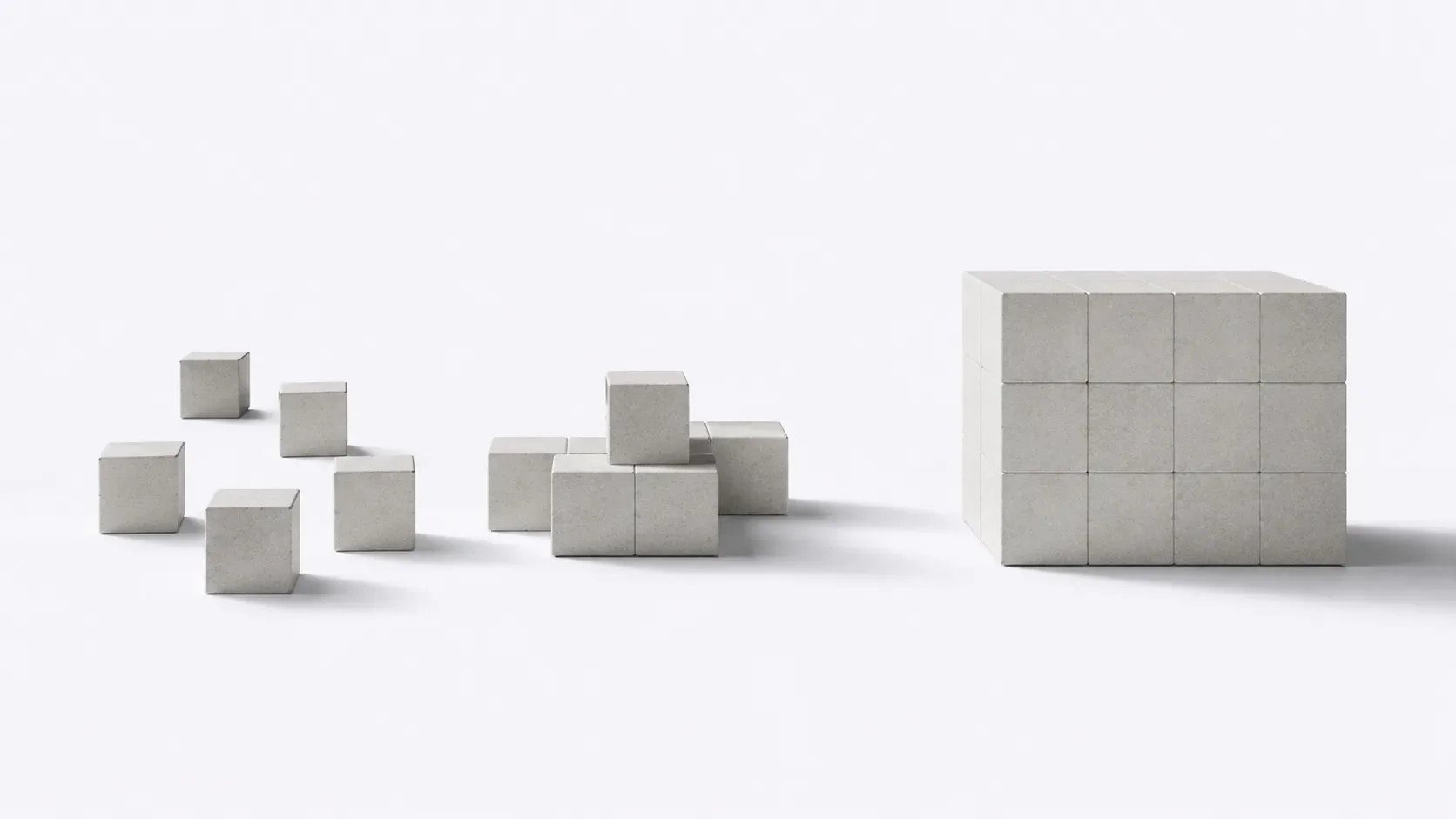 Cubes épars s'assemblant progressivement en un bloc unique