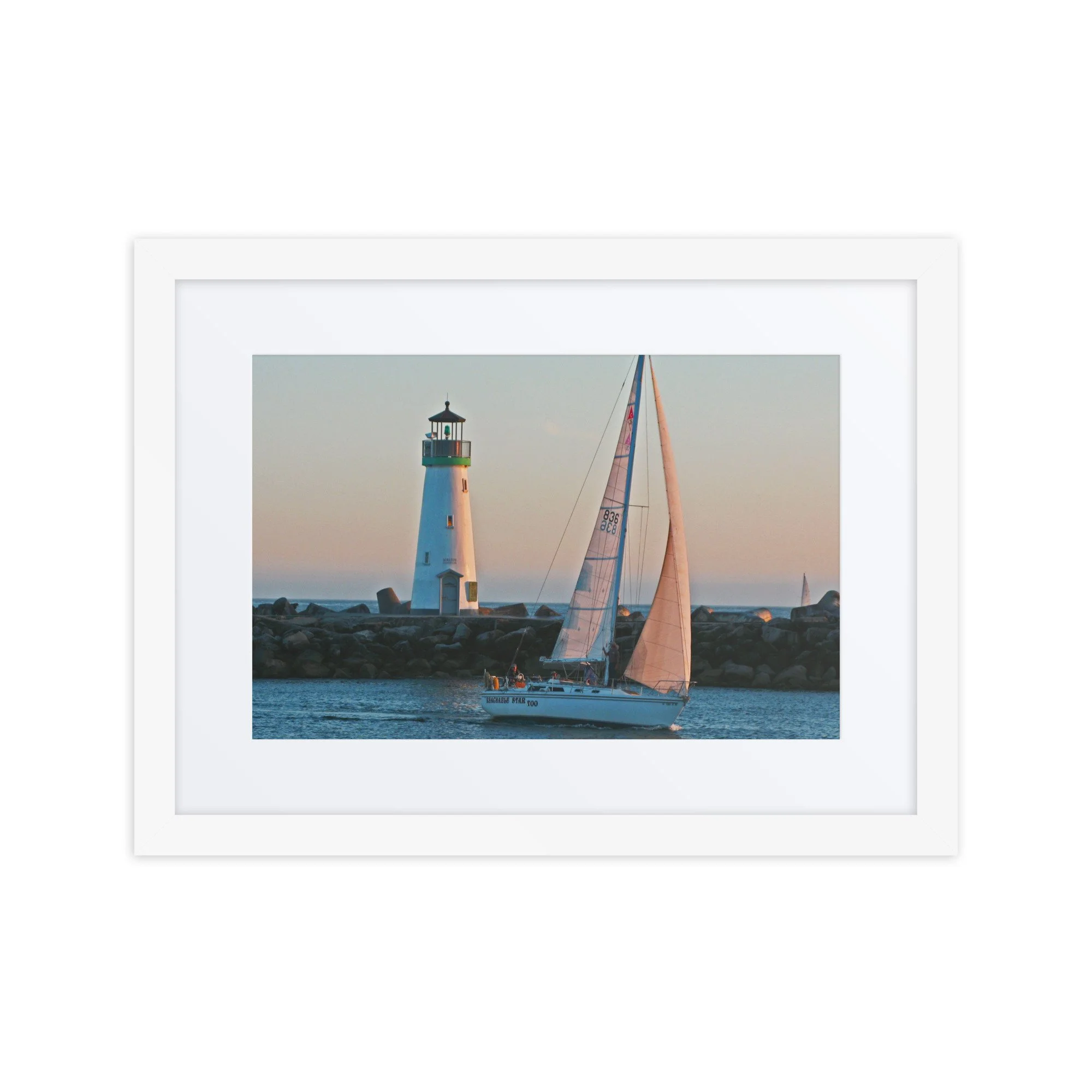 Lighthouse Sailboat Framed Print
