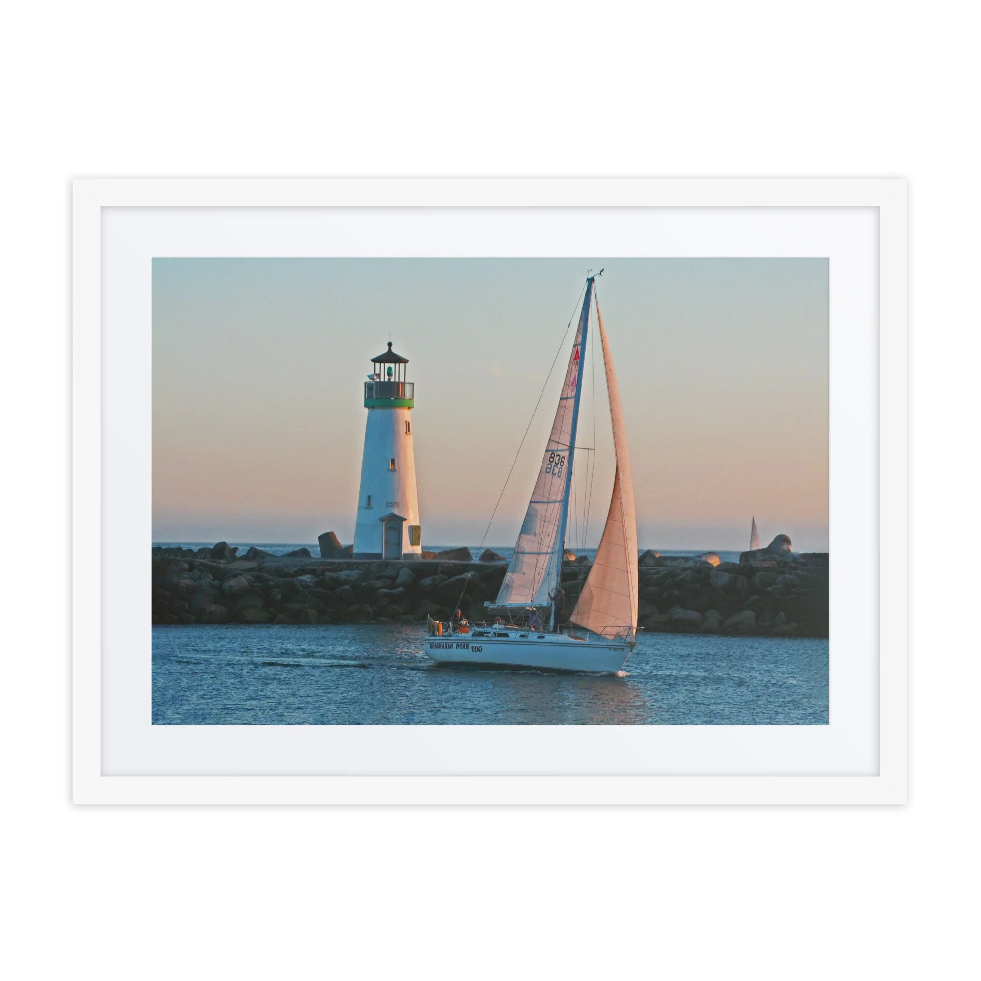 Lighthouse Sailboat Framed Print