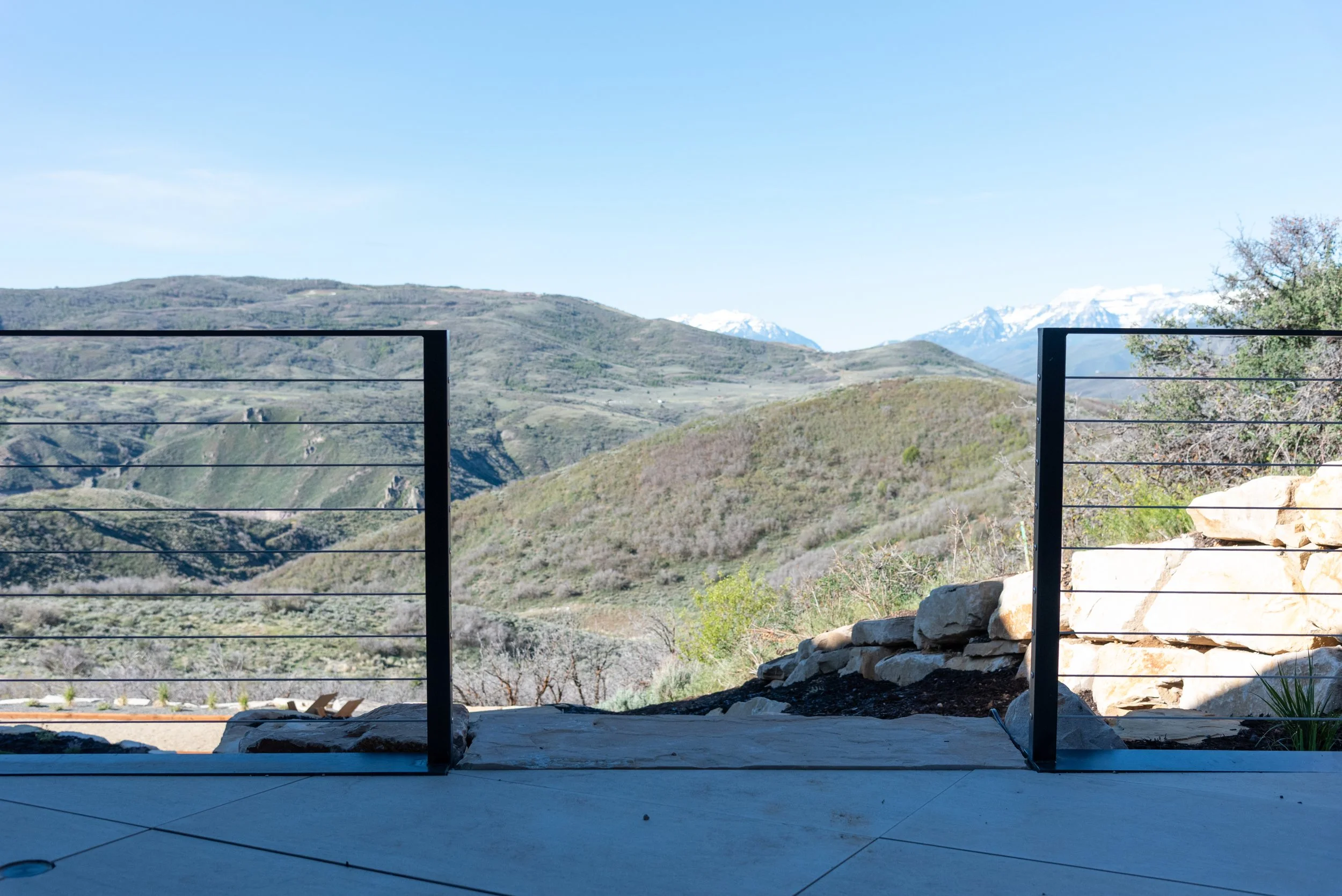 Hilltop view through custom steel guardrail