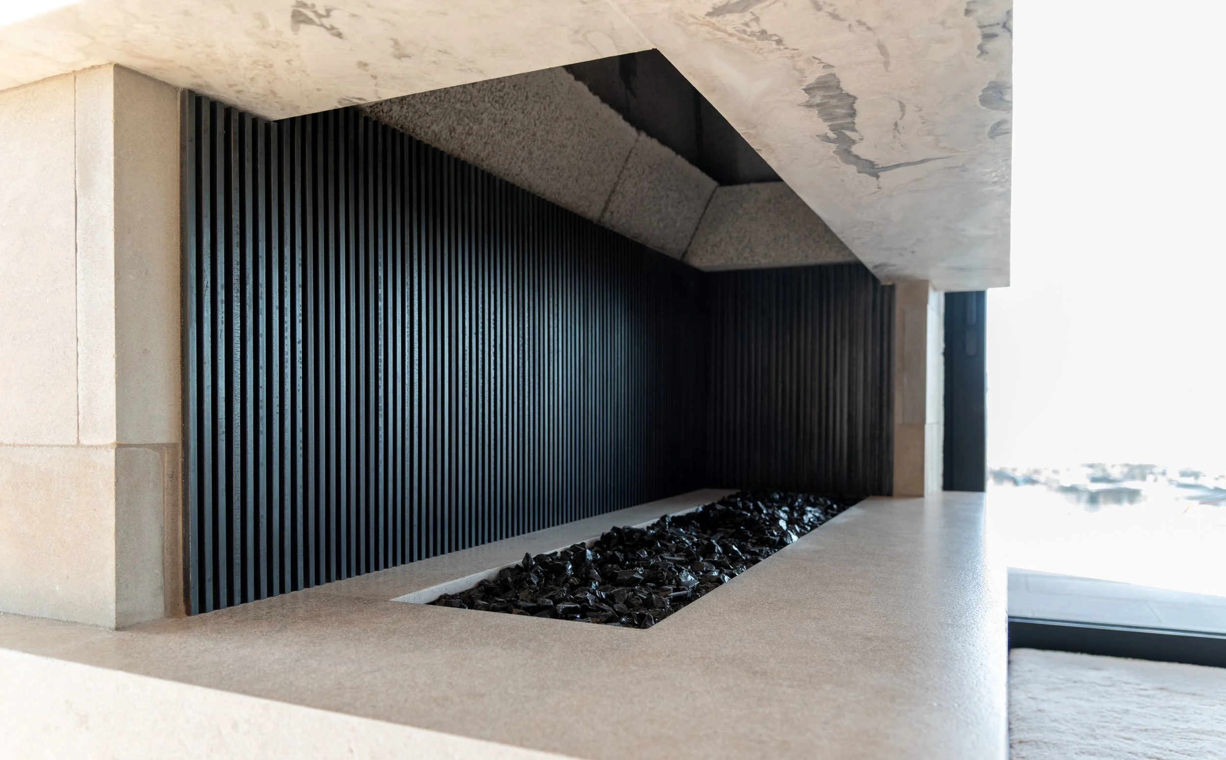 Inner detail of custom steel reeds on custom fireplace