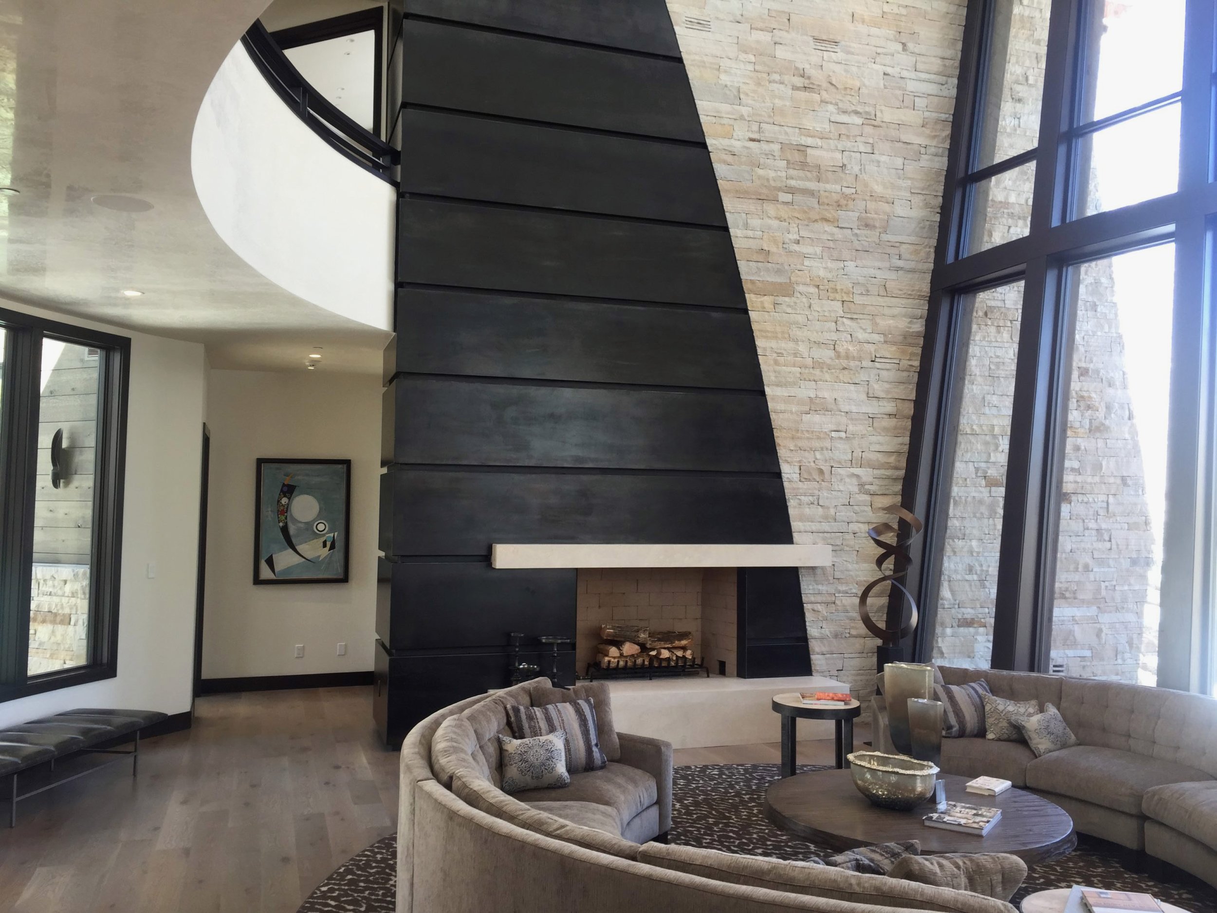 Floor to ceiling steel fireplace cladding