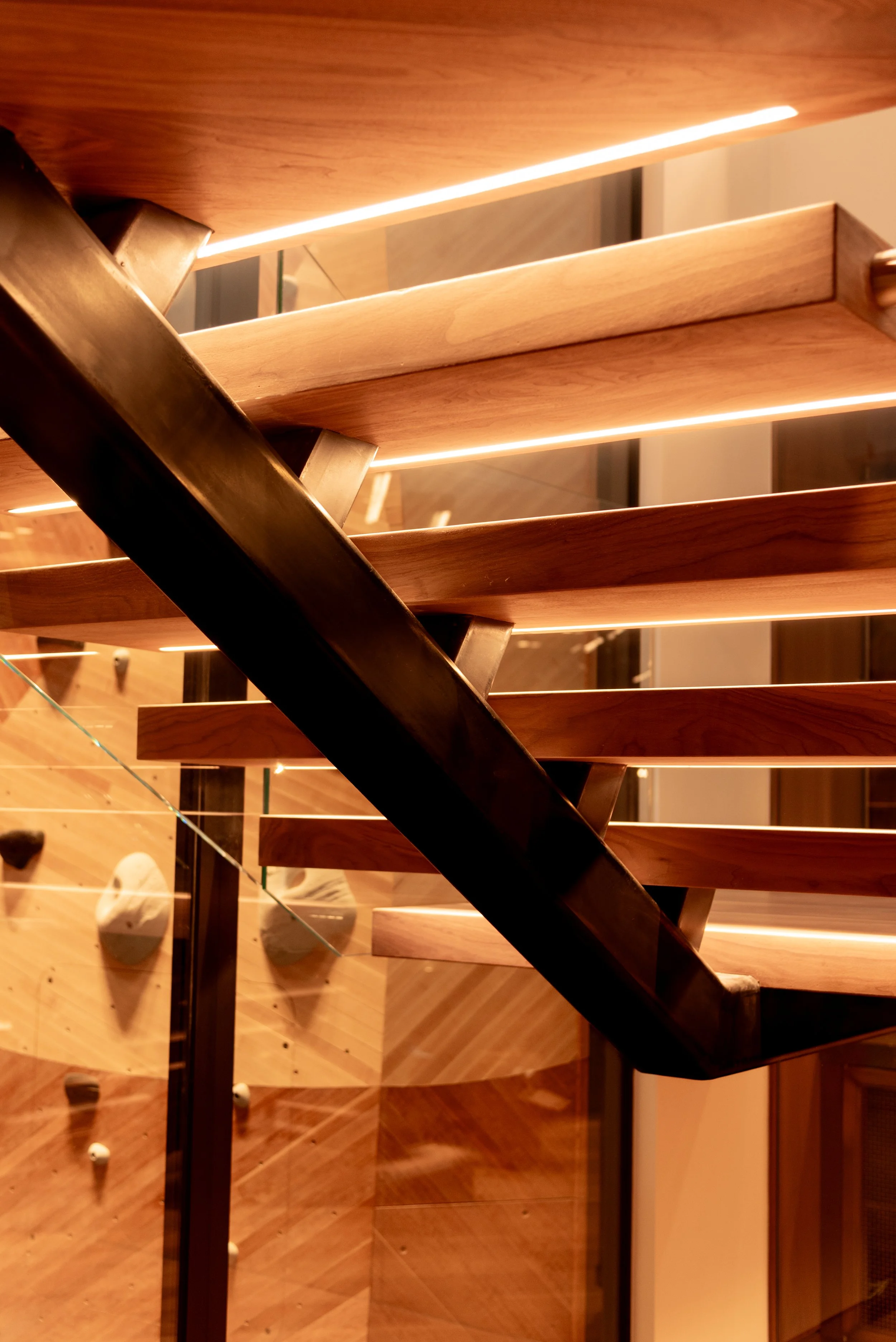 Detail of custom steel stringer with under tread illumination