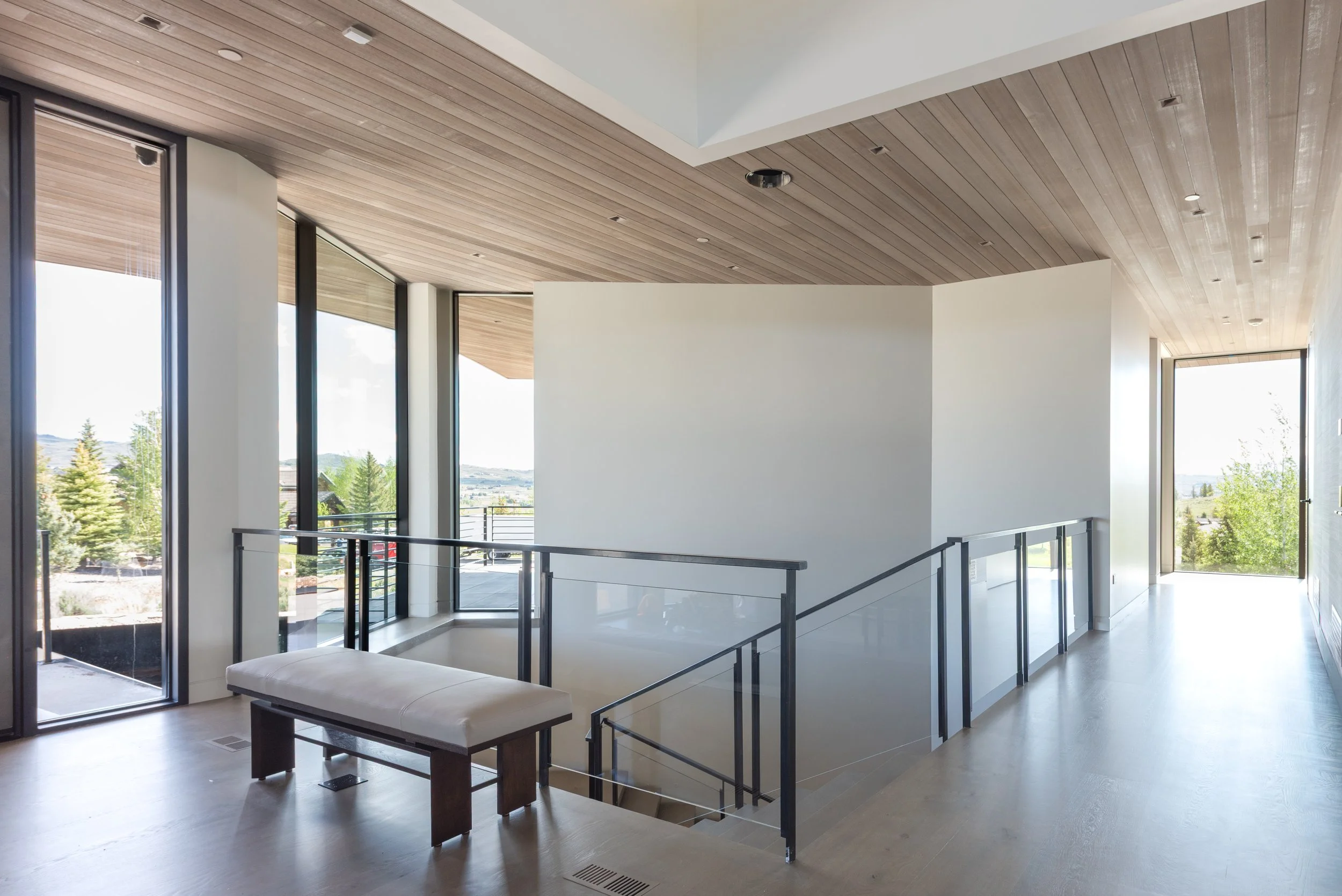 Glass rail with steel posts and top line