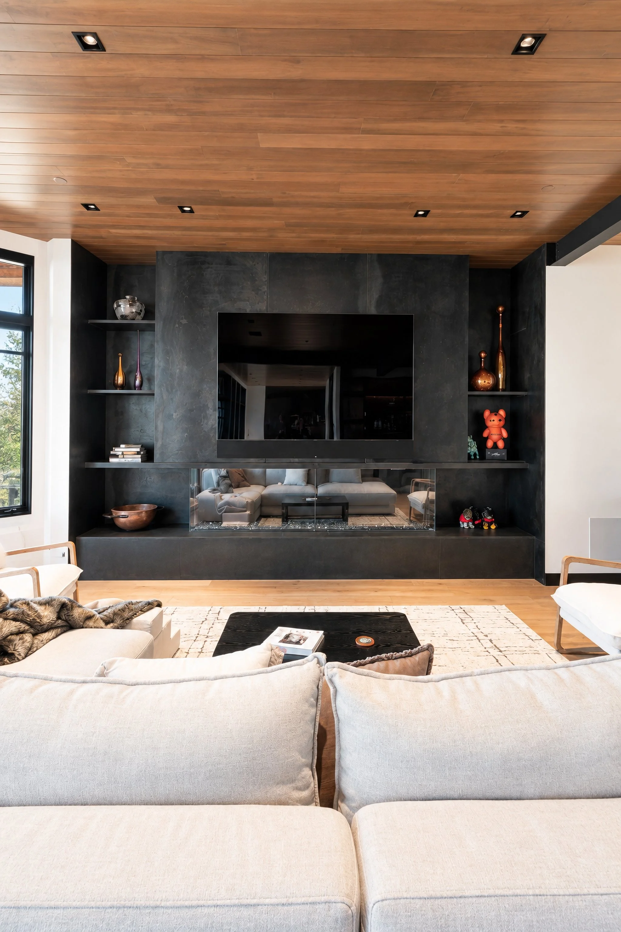 Steel cladding around fireplace with built in shelves