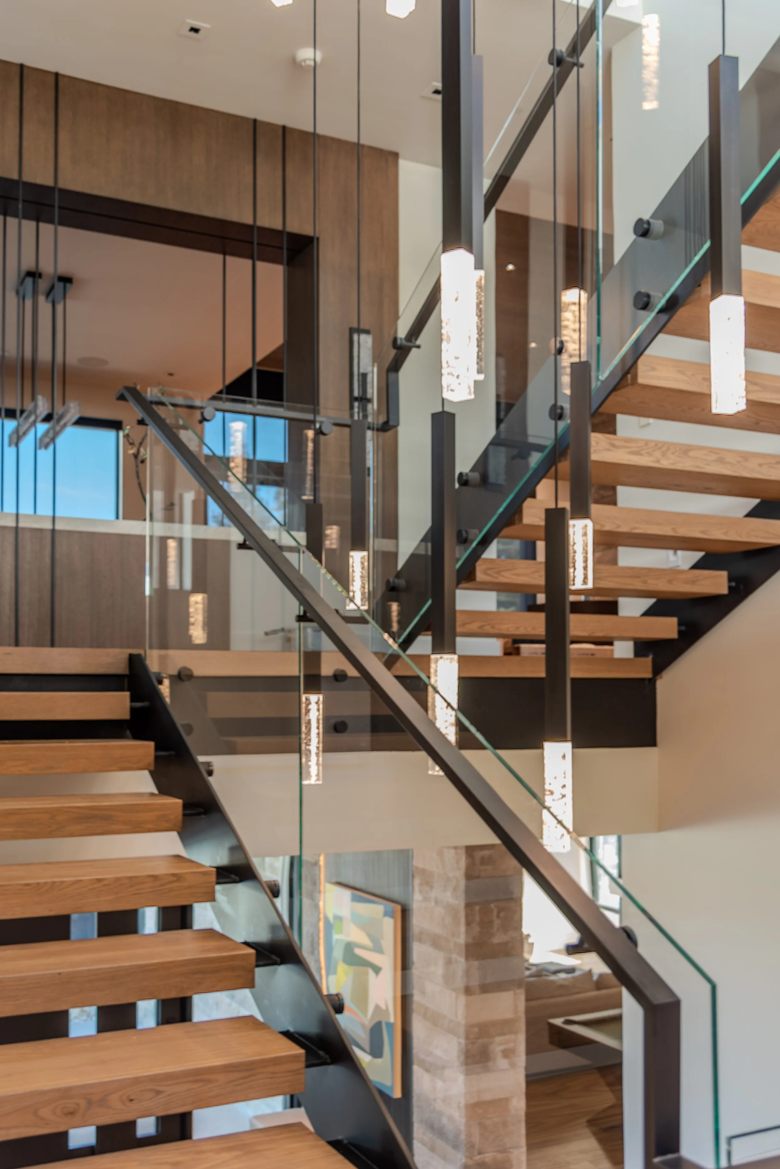 Close up dual steel stringers on custom stair by Innovative Iron