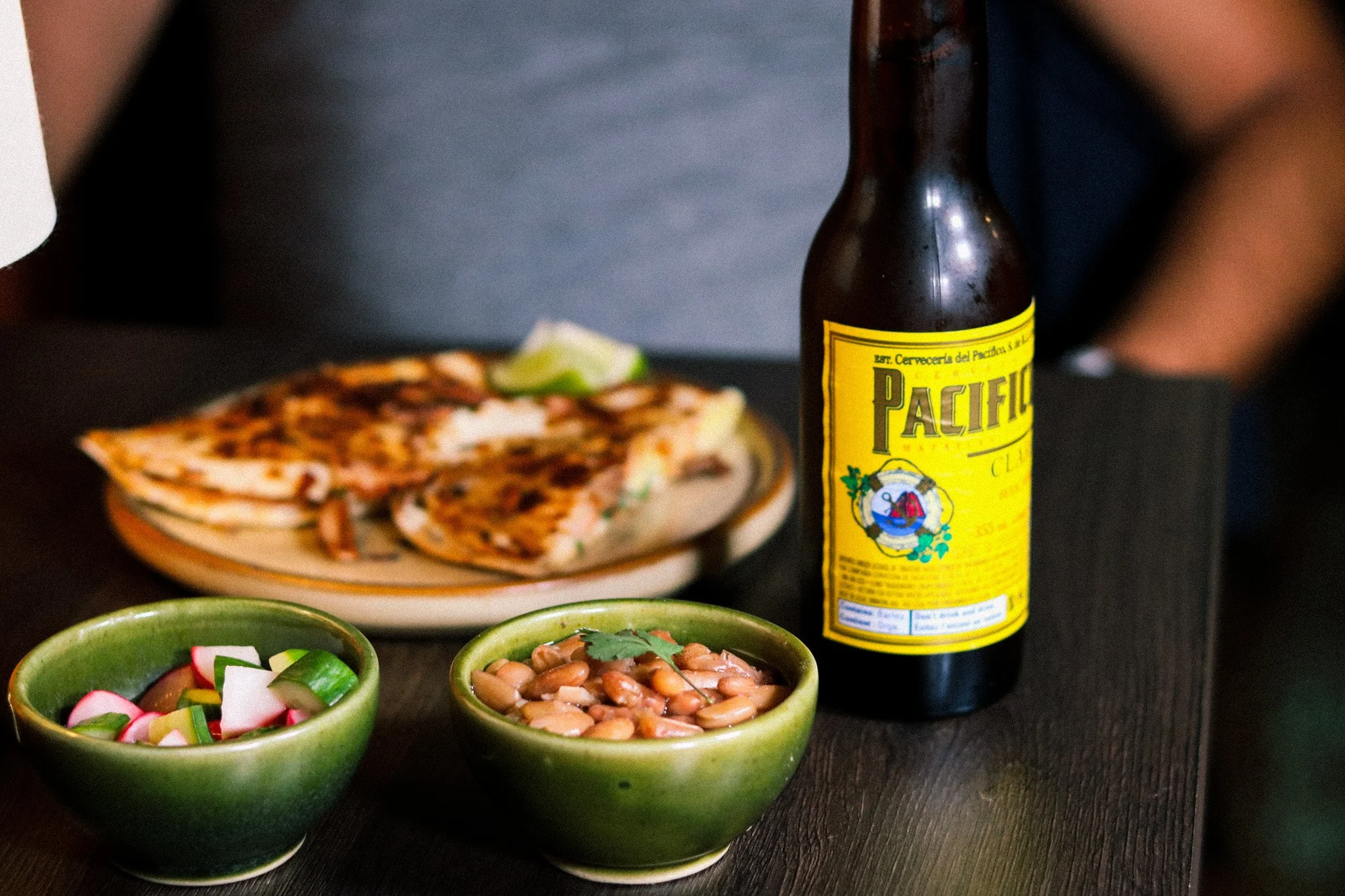 Why Mexican beer with Mexican food?

Light, crisp lagers like Pacifico are designed to refresh between bites, cutting through richness, balancing spice, and keeping your palate ready for the next taco.

It&rsquo;s not just a pairing. It&rsquo;s part 