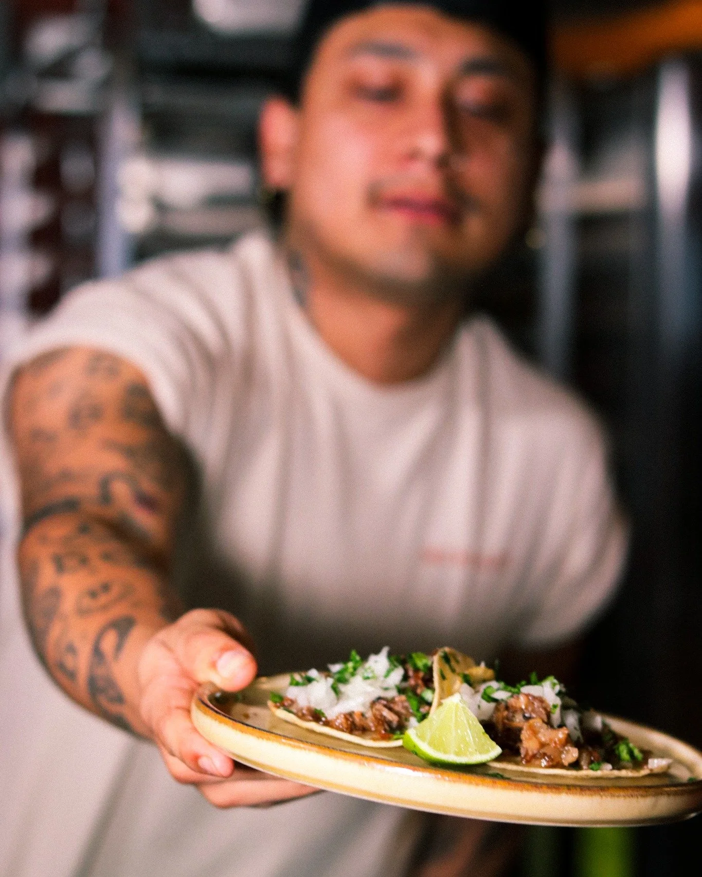 This is how a taco is meant to be handed to you &mdash; with pride.
Onion, cilantro, lime. No shortcuts, no substitutions. That's the way of the taquero.
The taco de calle wasn't born in a restaurant &mdash; it was born on the corner, passed hand to 