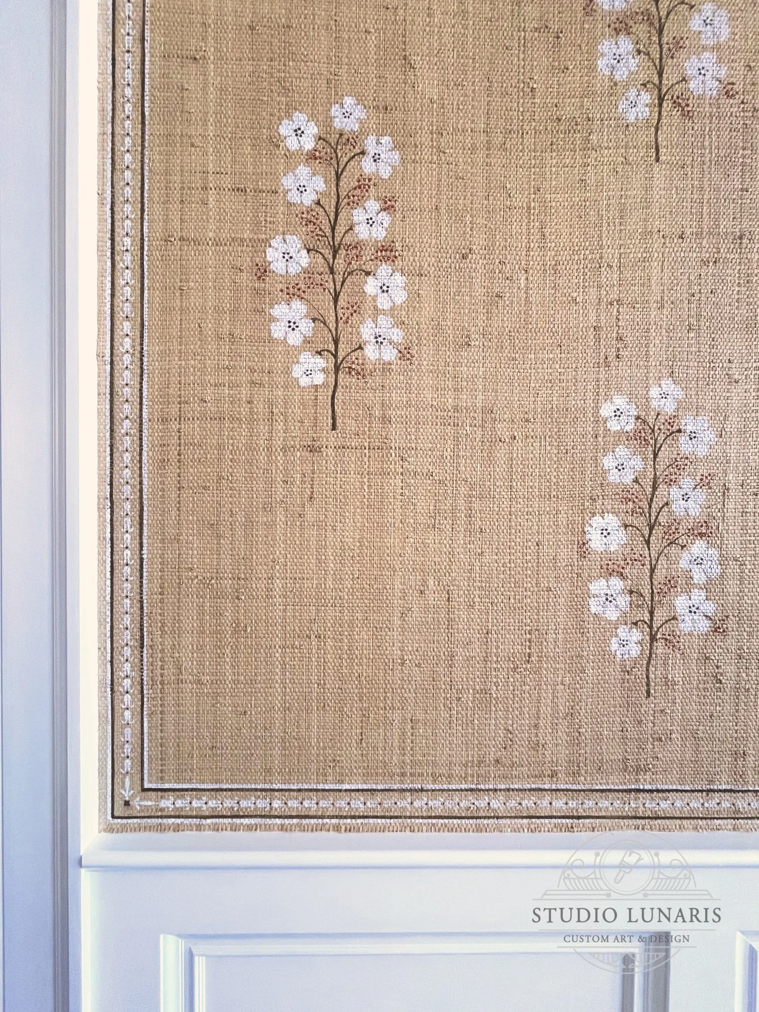 Floral stencil pattern on existing grasscloth wall covering.