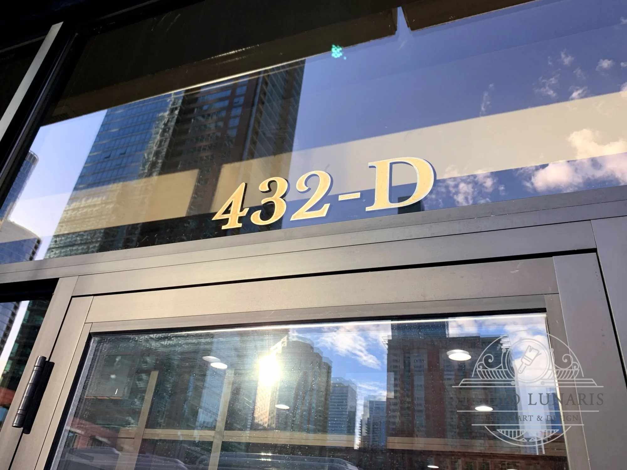 Above door gold leaf street address lettering