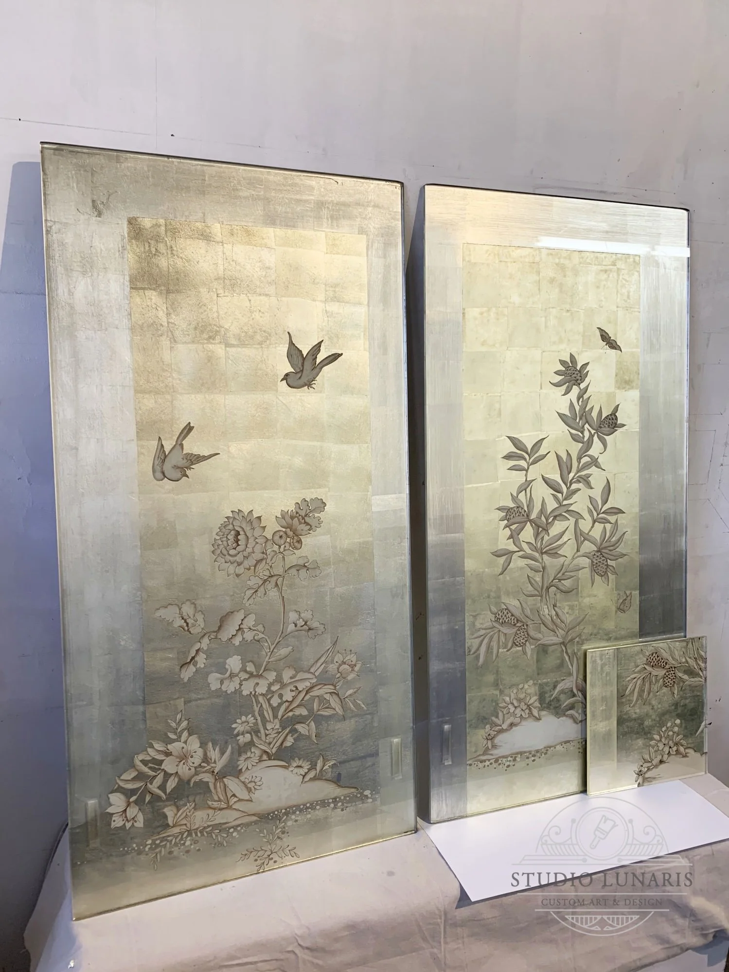 Bathroom verre églomisé sliding doors with a floral themed painted elements. Door on the right was remade to match the original due to excessive damage.