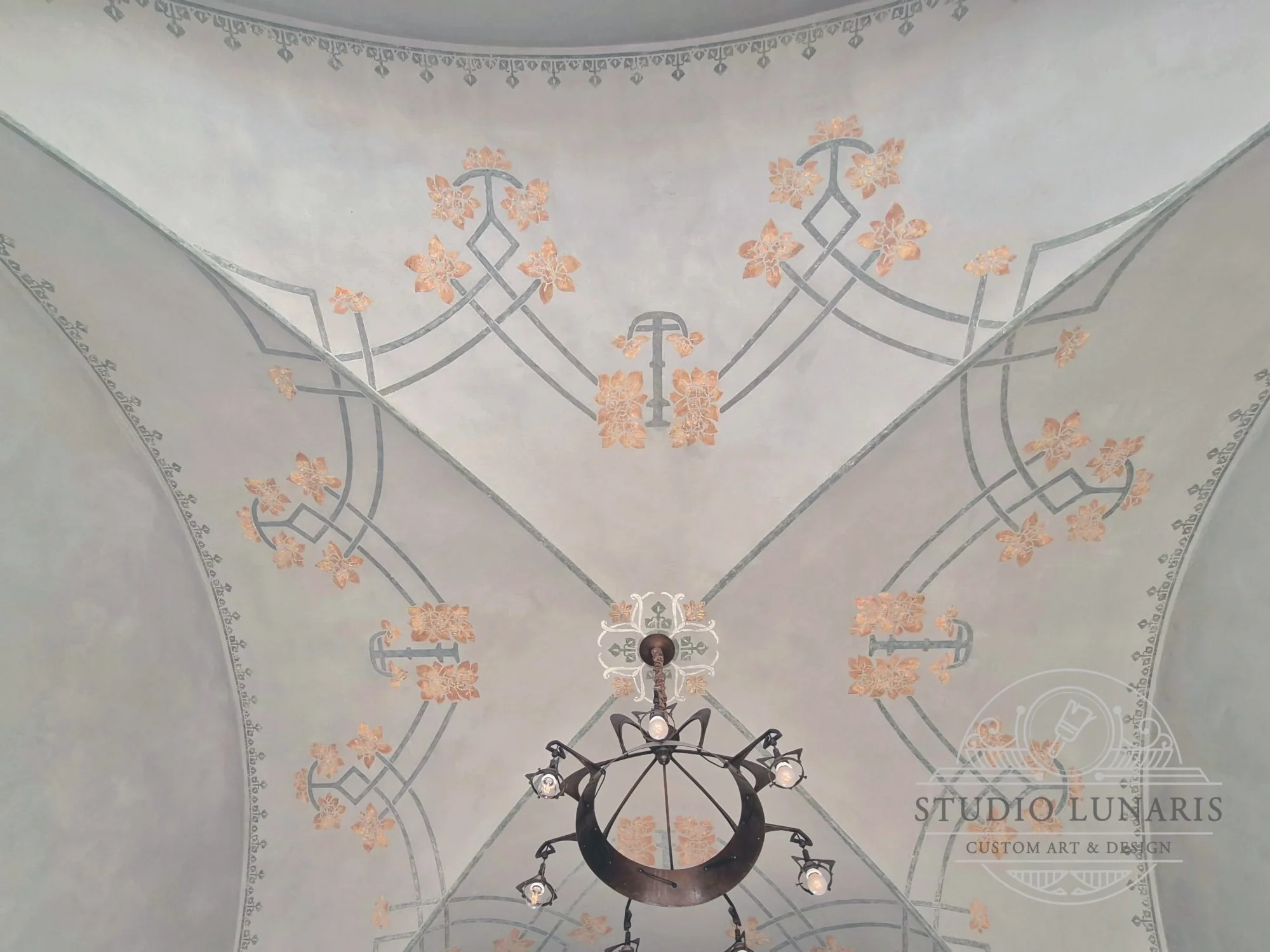 Vaulted kitchen ceiling with an Art Nouveau inspired raised plaster stencil design over soft, green-gray marmorino plaster