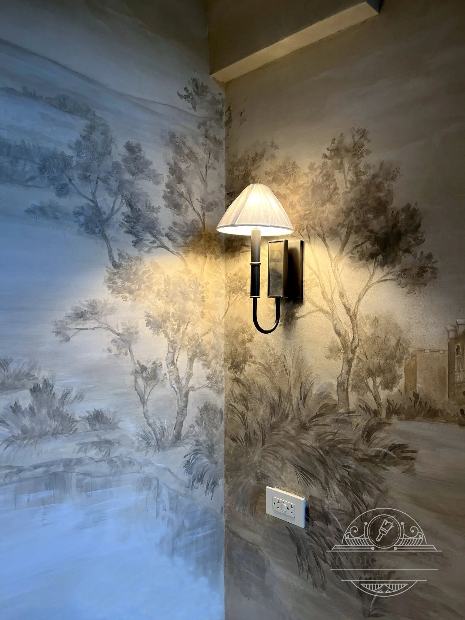 Powder room mural with a scenic countryside theme in sepia, grisaille color palette