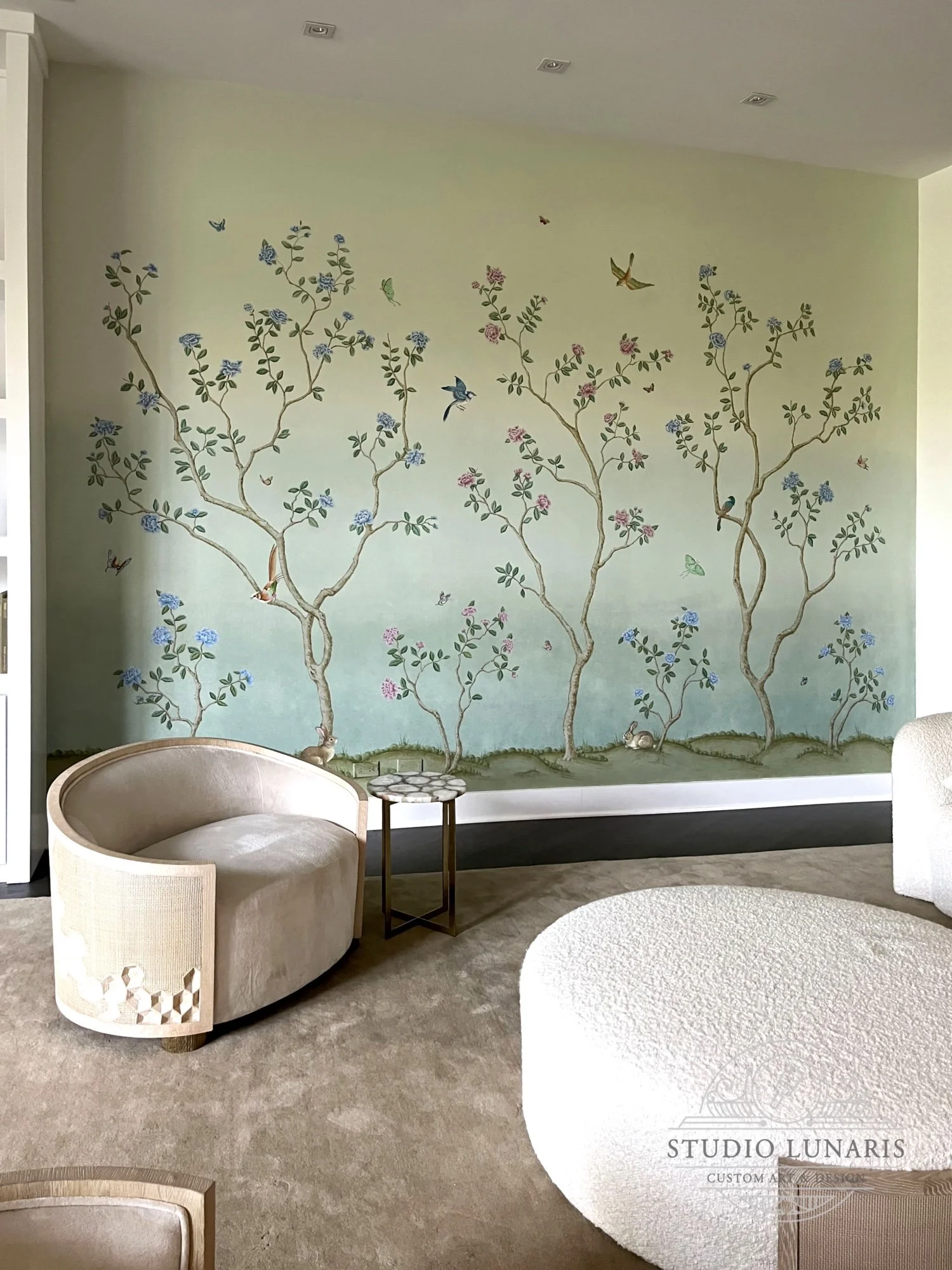 Living room mural with a chinoiserie inspired scenic design
