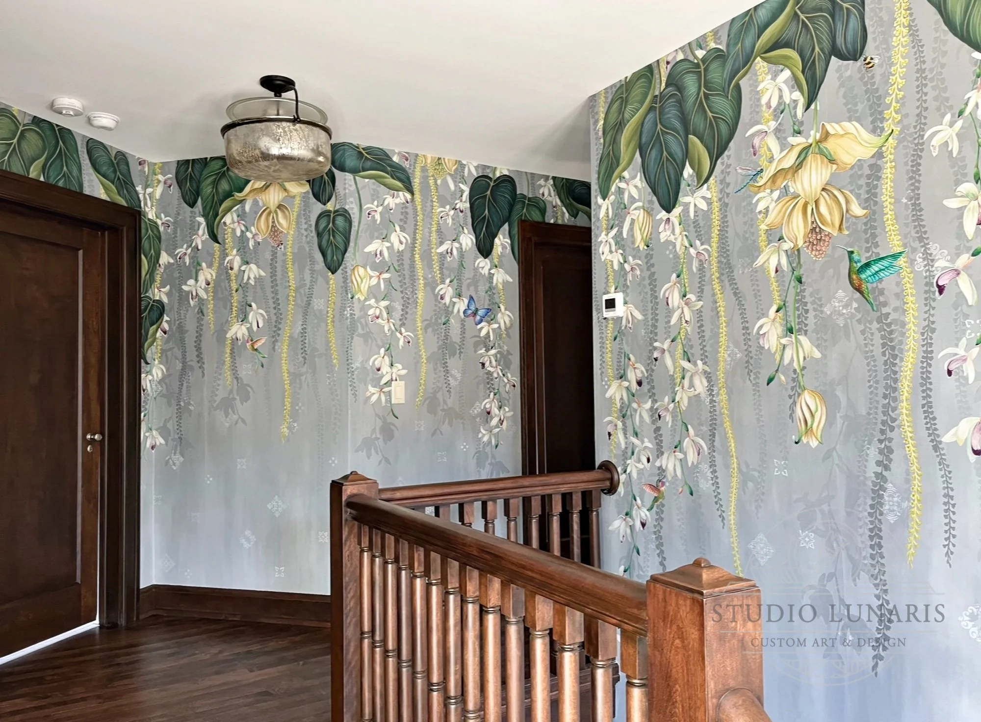 Hallway mural with a lush tropical theme